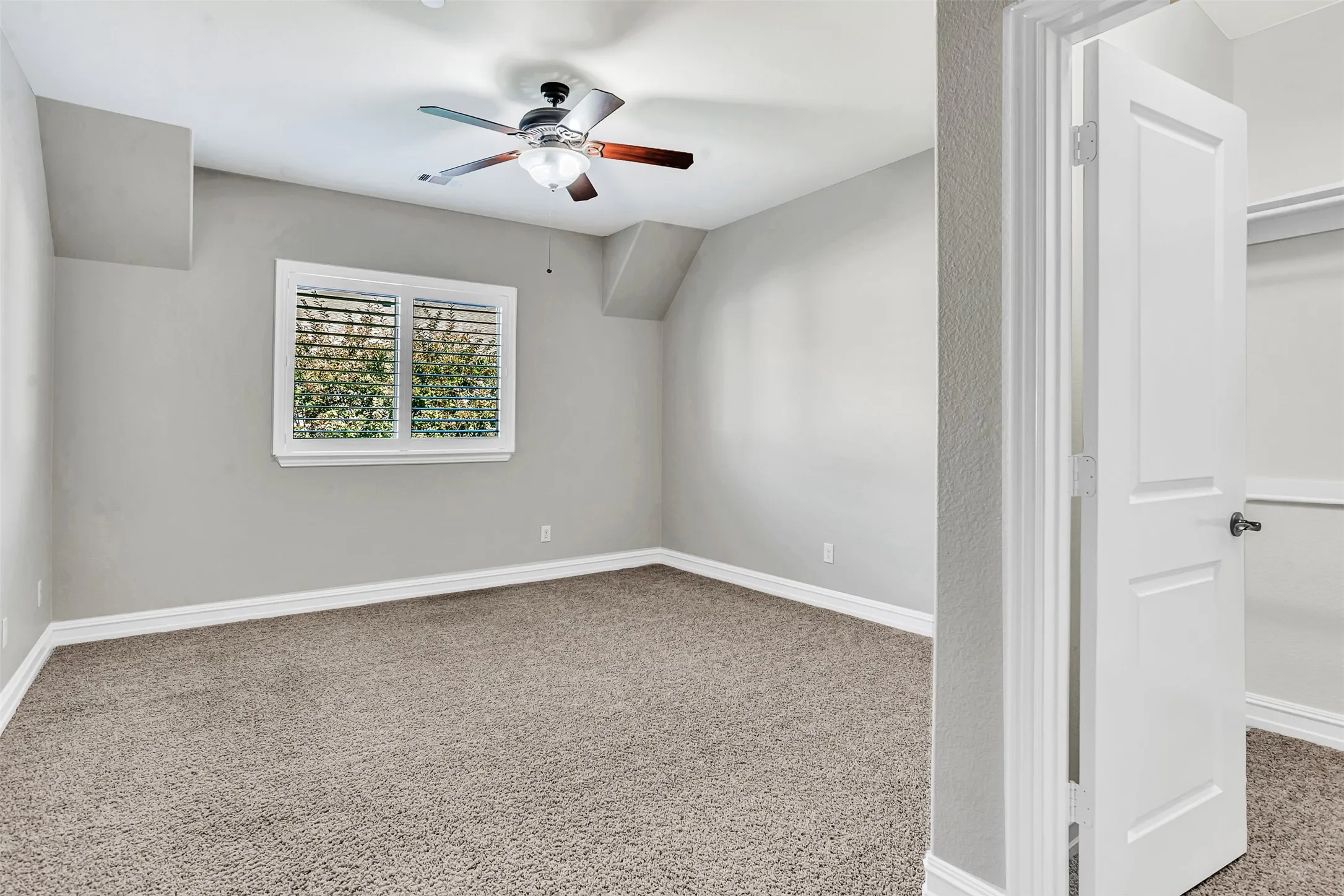 Bedroom 3 has a large window with Plantation shutters overlooking the backyard and also has a large walk-in closet.