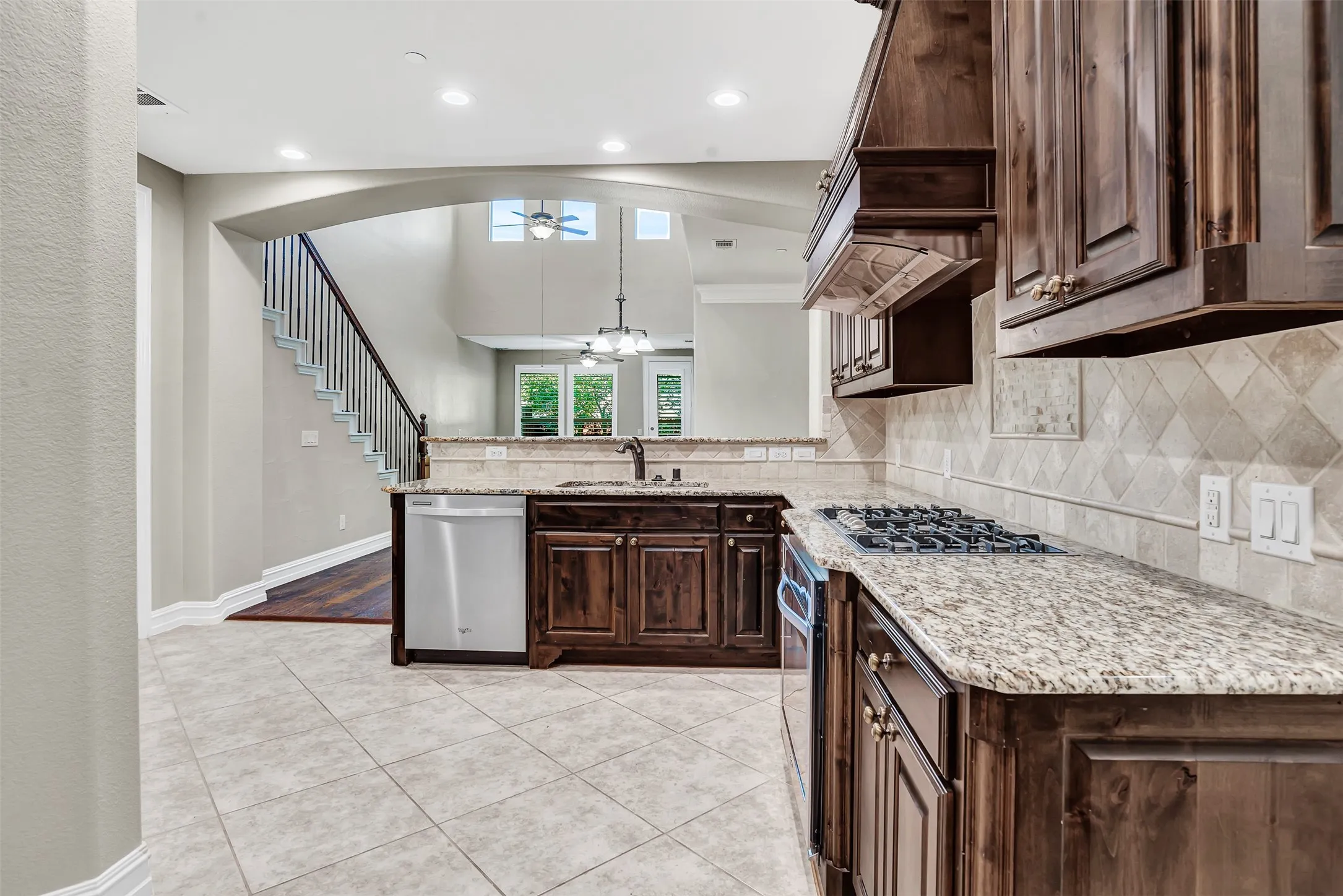 Gorgeous kitchen looks to the dining area and living room with the glorious open floor plan