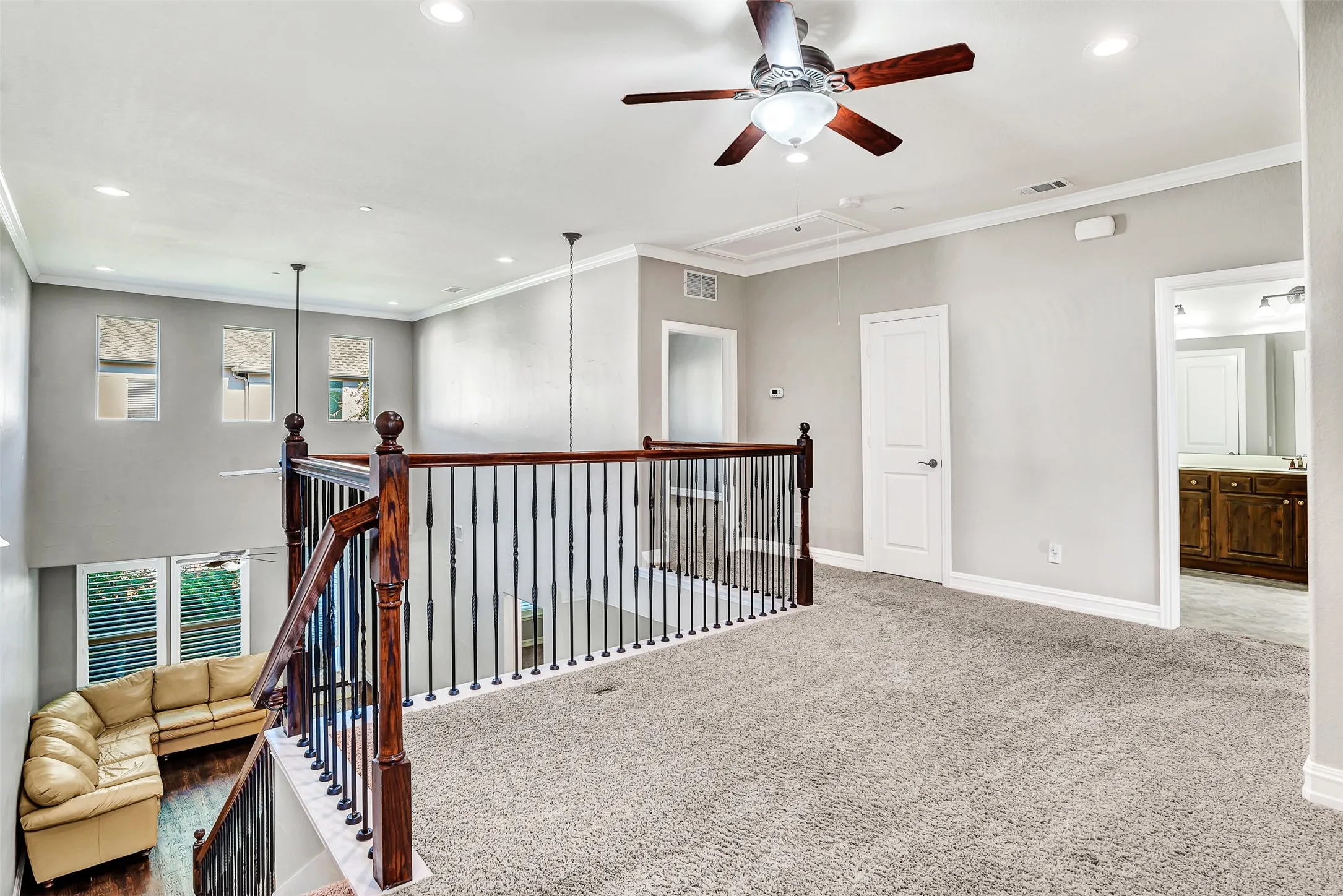 This lovely area has so many uses! Great for a home office, a quiet reading nook, meditation, yoga, arts and crafts...the wrought iron balusters provide light from the large windows in the family room and keep the rooms open and airy.