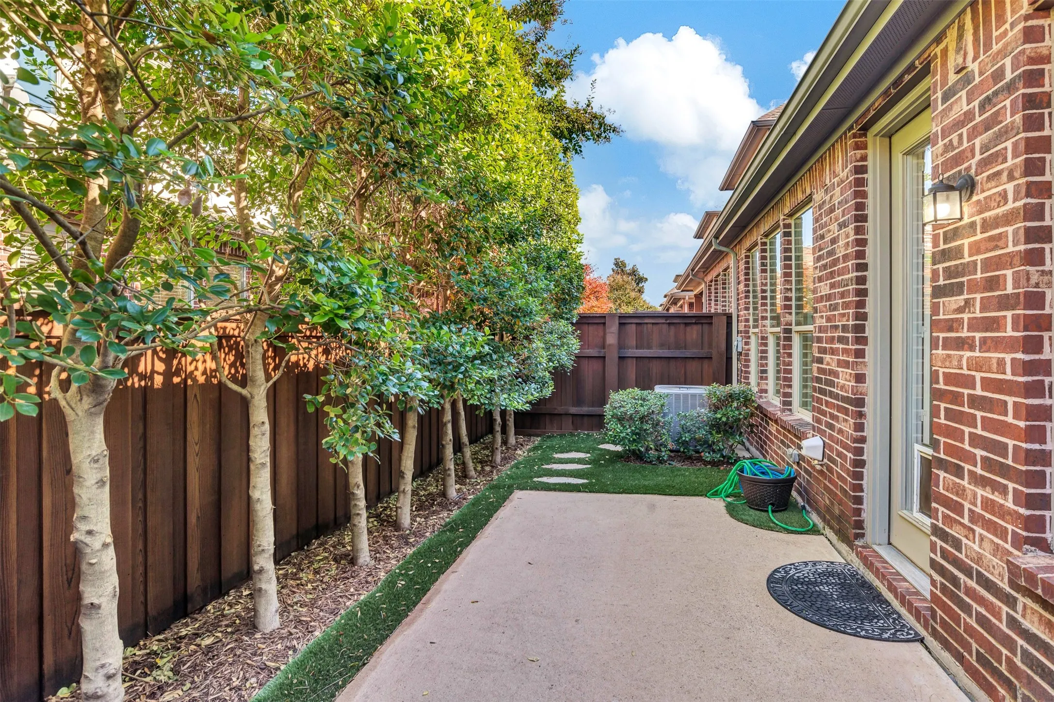 Small but mighty defines this backyard - just the perfect size to enjoy any time you want, but requires minimum upkeep. You'll love the convenience.