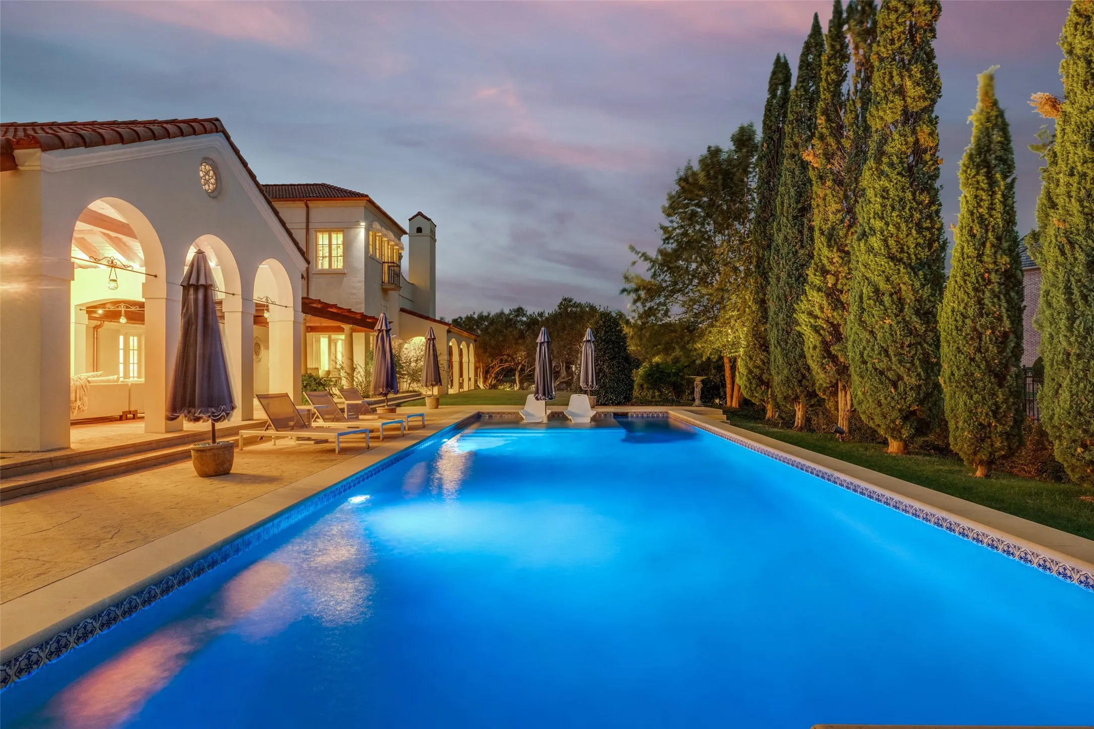 Expansive outdoor swimming pool with integrated lighting