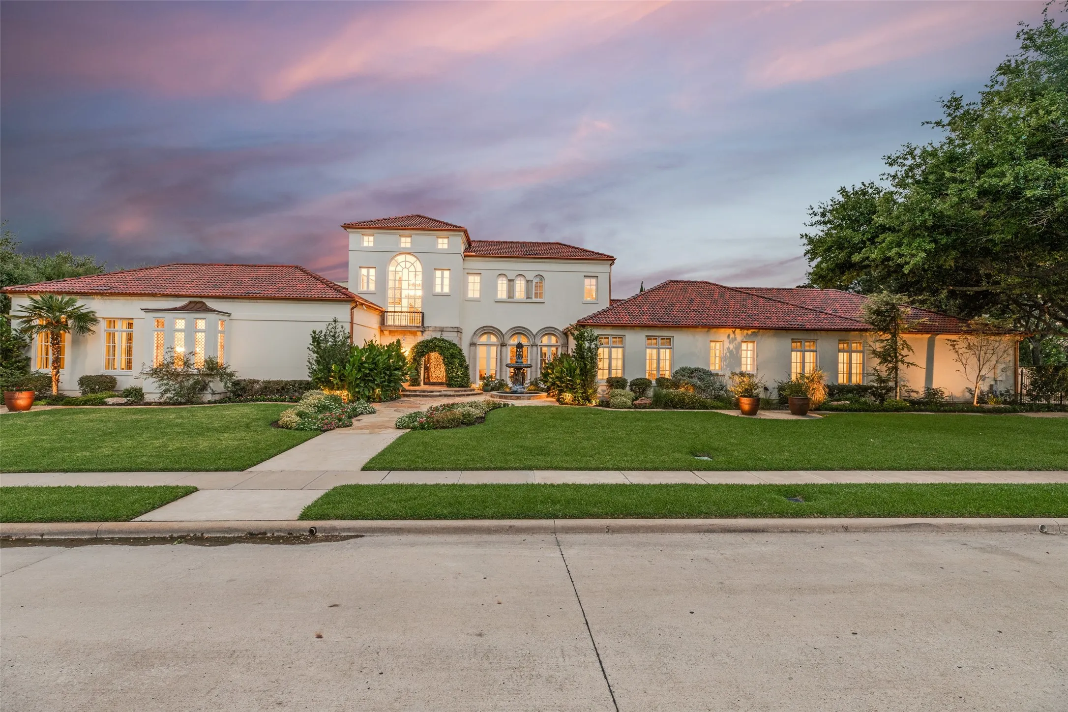 Mediterranean-inspired architecture with a red tile roof and stucco exterior