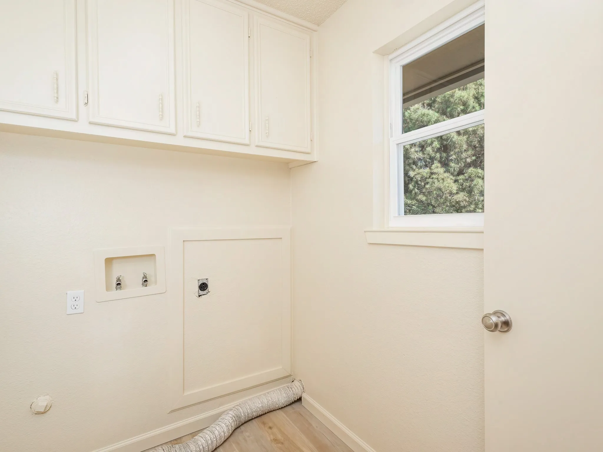 Laundry room with amble cabinets
