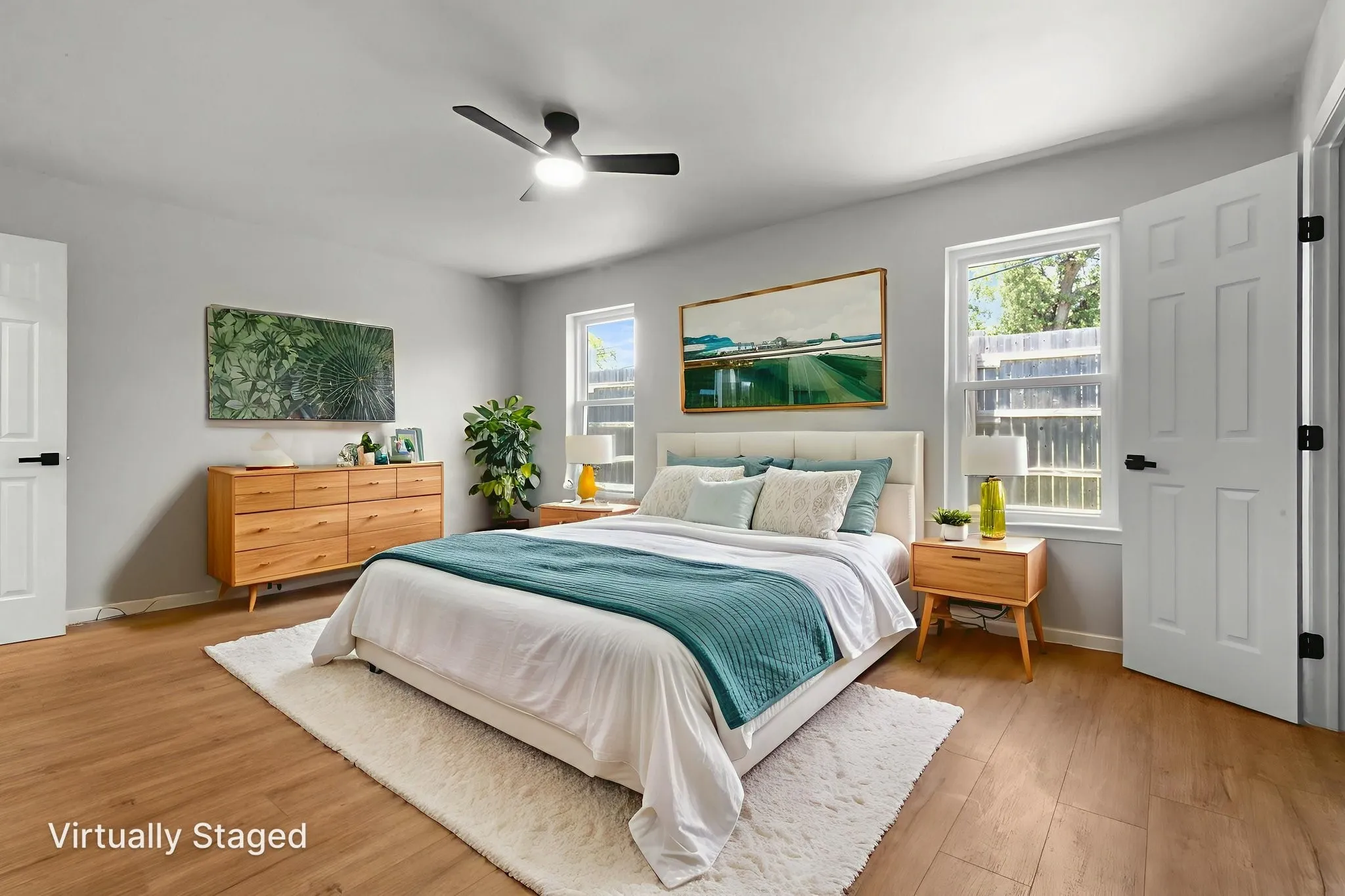 Light gray walls complement the wood-finish flooring