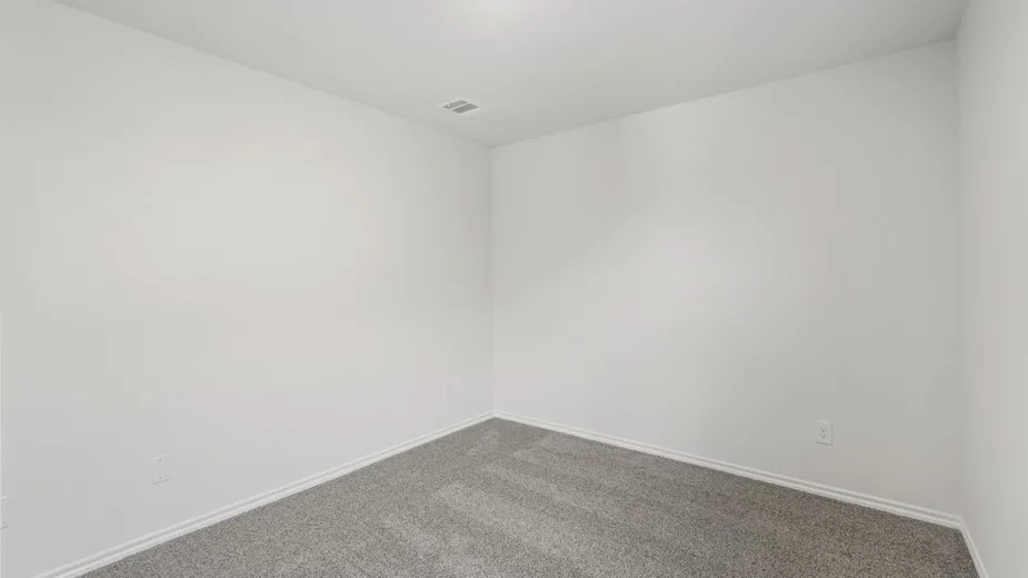 Recessed lighting, gray carpet flooring, and neutral wall tones
