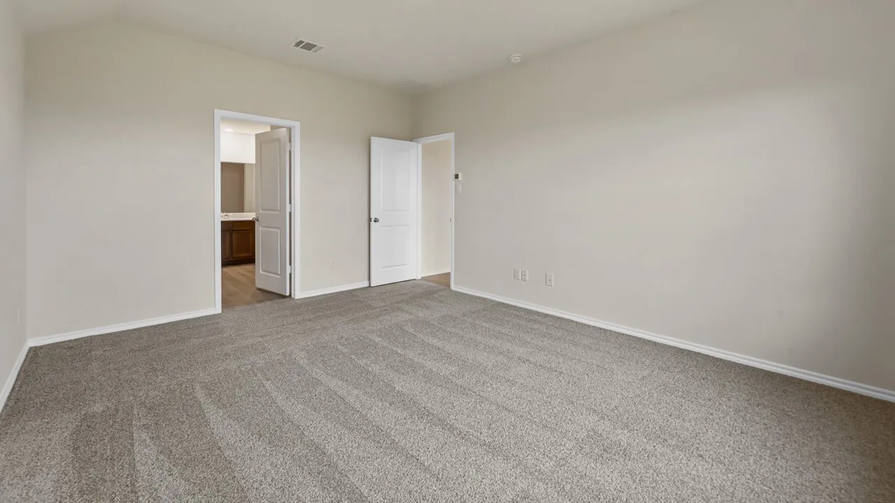 Neutral wall paint, carpet flooring, and white trim