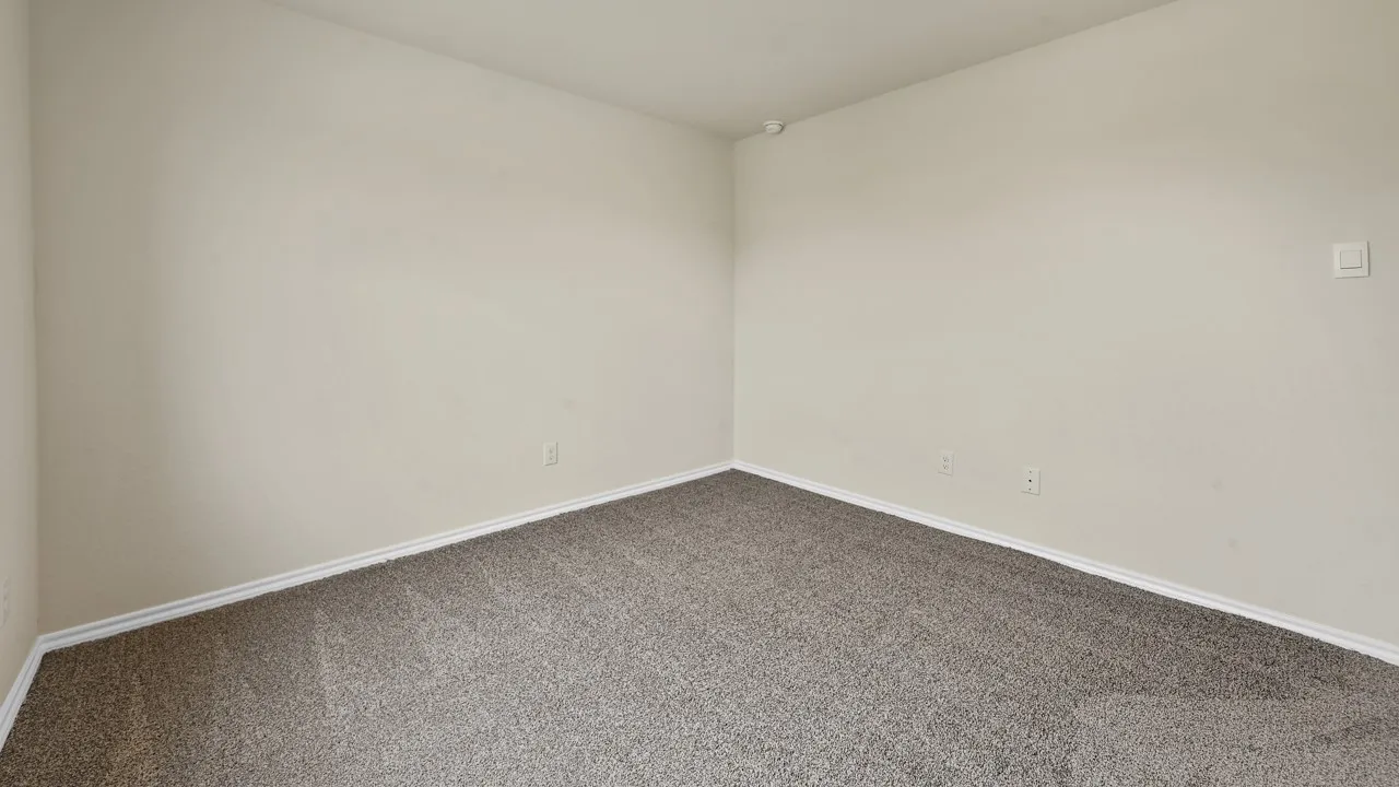 Wall-to-wall carpeting and neutral wall tones