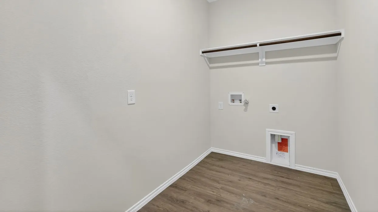 Wood-finish flooring, light neutral wall paint, and a built-in hanging rod
