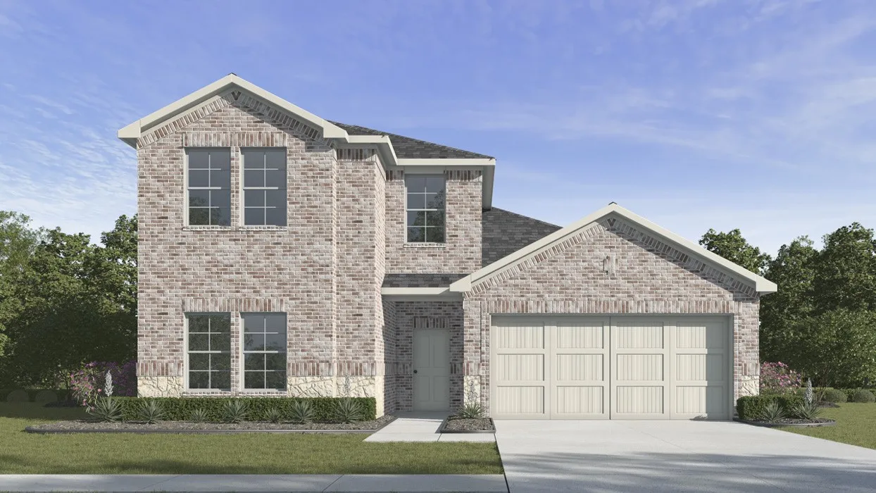 Two-story brick exterior with stone accents, featuring a multi-pane garage door and a concrete driveway