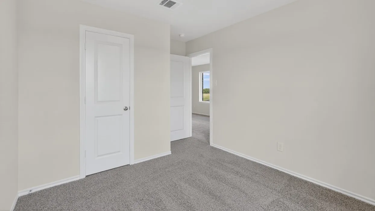 Soft gray carpet flooring complemented by light-toned wall finishes