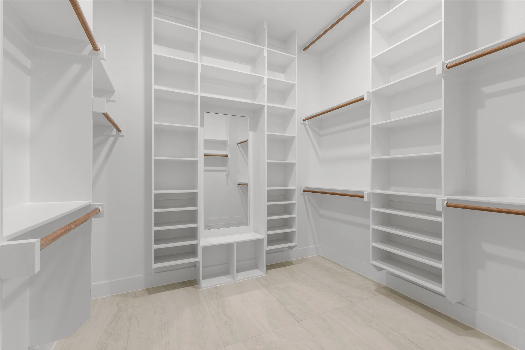 Integrated storage system with multiple shelves, hanging rods, and pull-out drawers