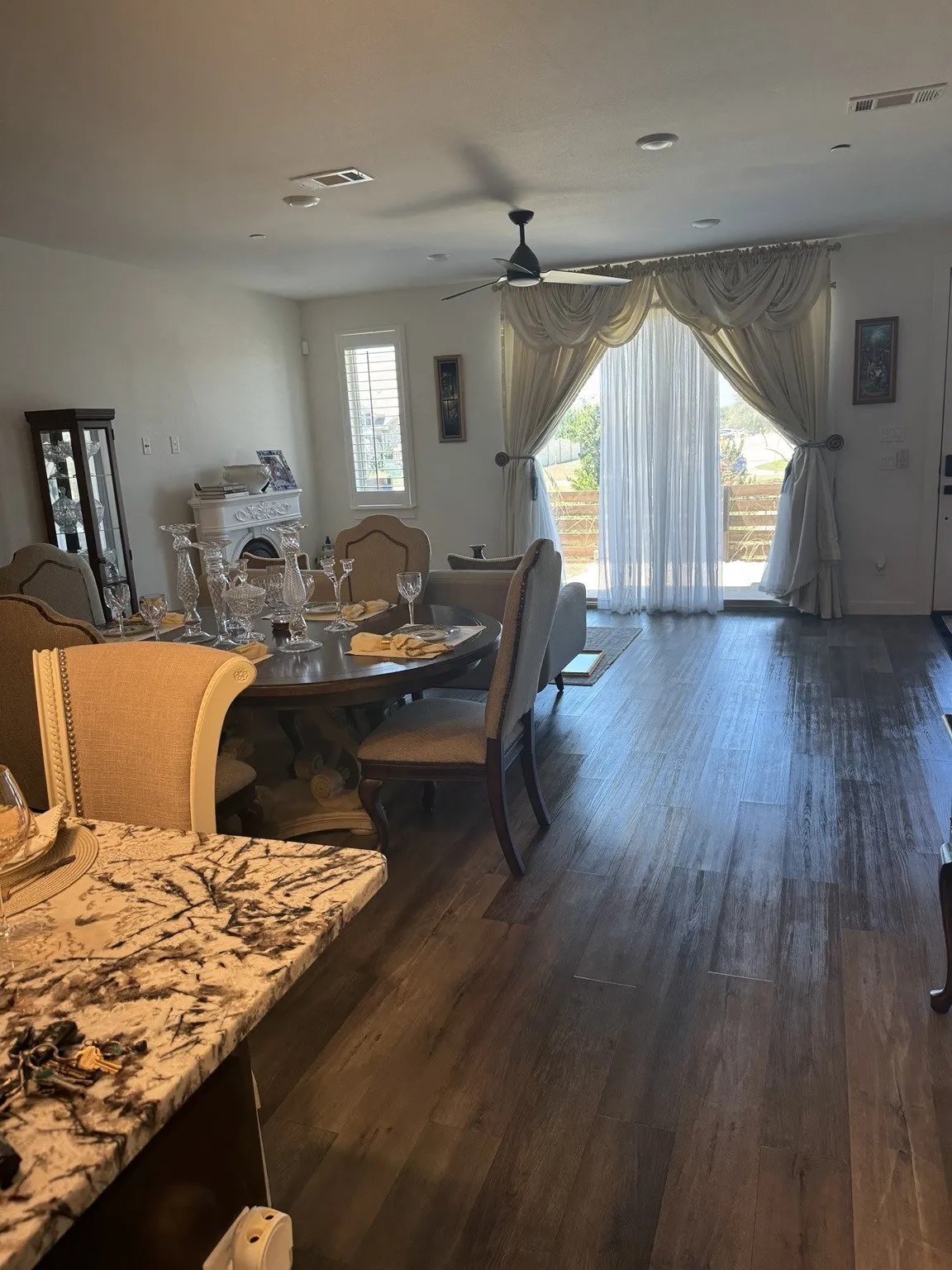 Wood-finish flooring throughout, with a granite-style countertop