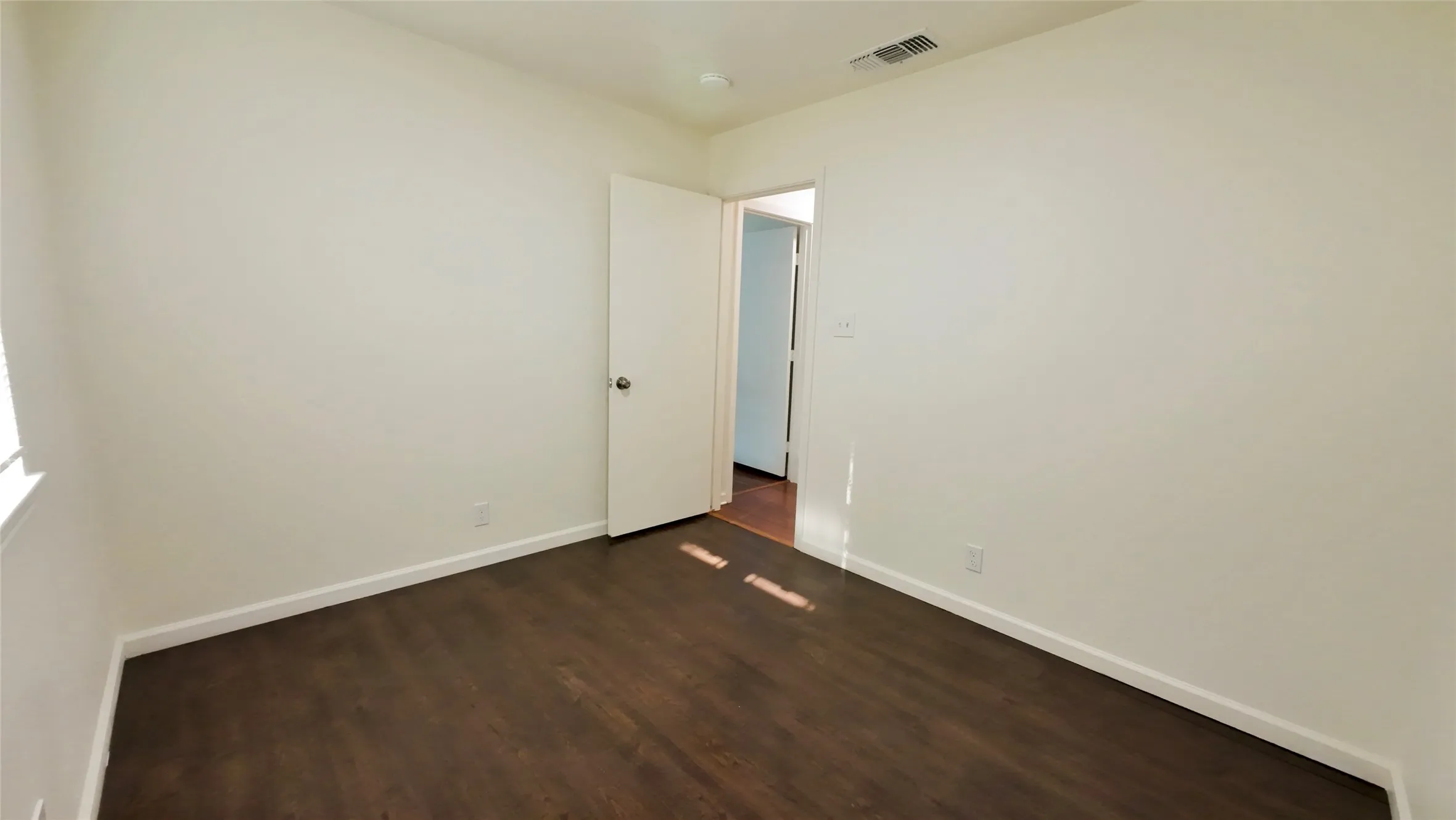 Wood-finish flooring with crisp white walls
