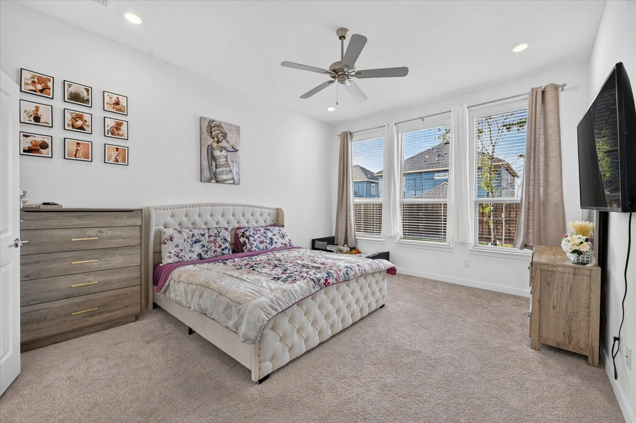 Plush carpeting, recessed lighting, and a ceiling fan with light fixture
