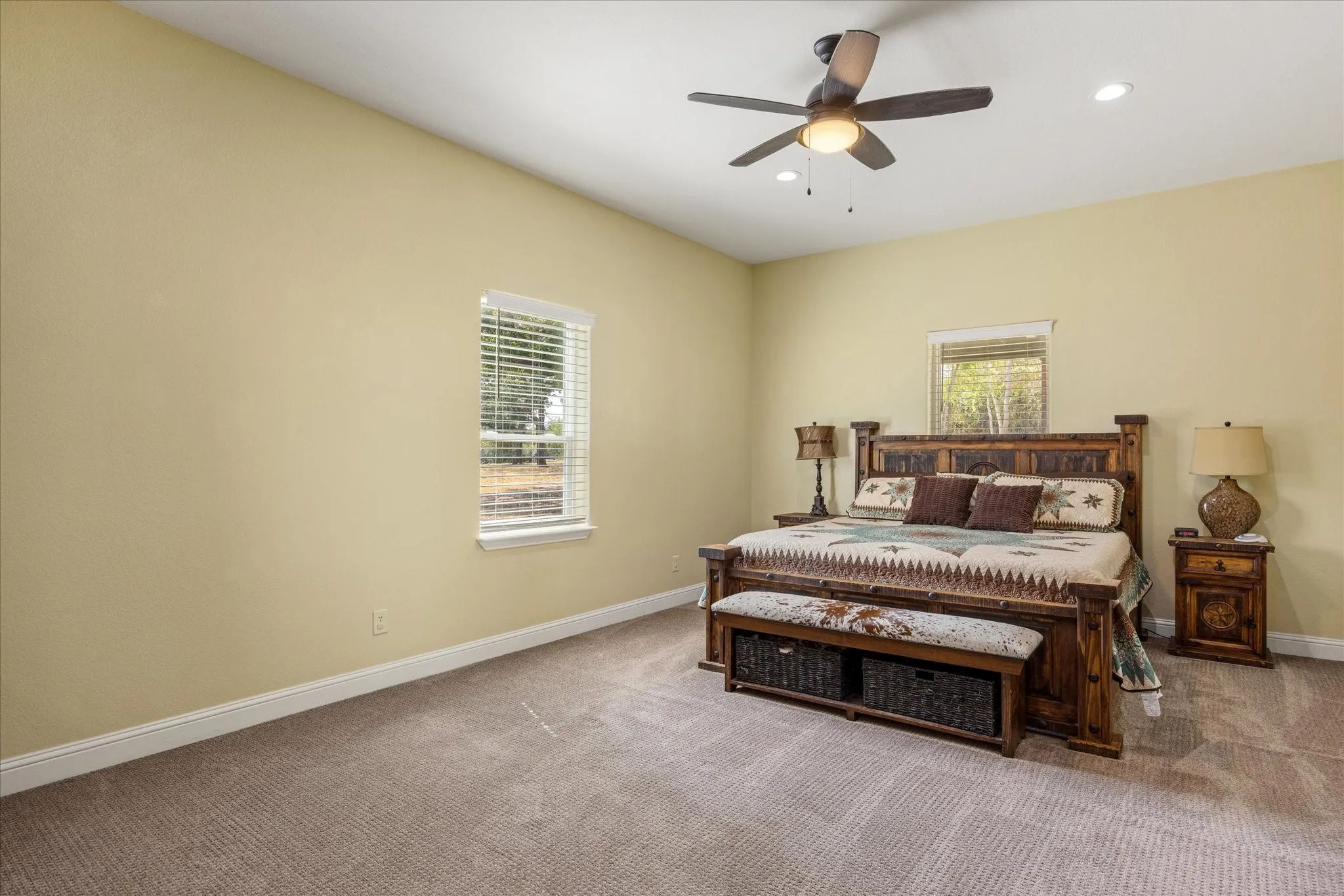 Large primary bedroom has plenty of room for all of your furniture.