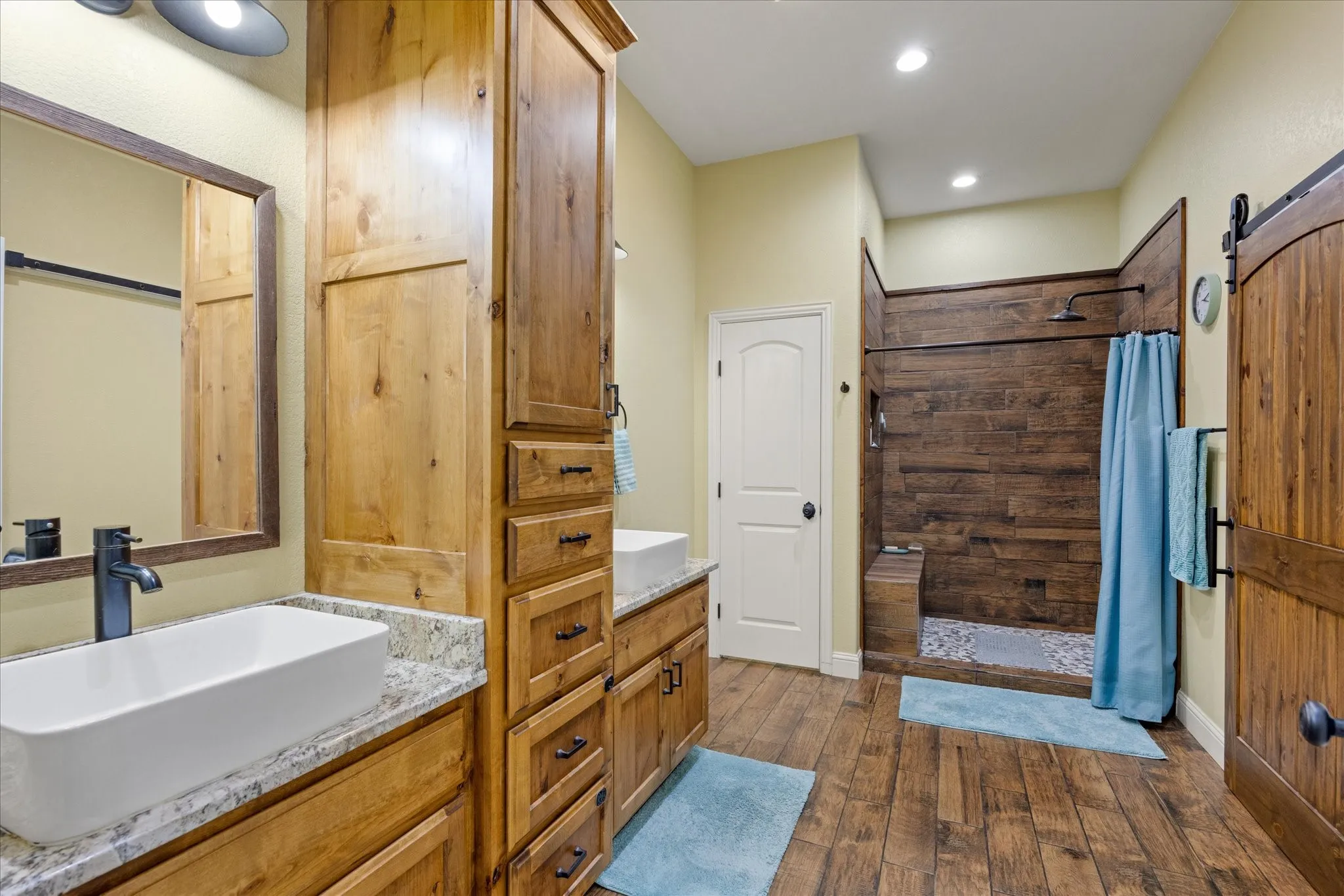 Dual sinks, lots of storage space, walk-in shower, and walk-in closet.