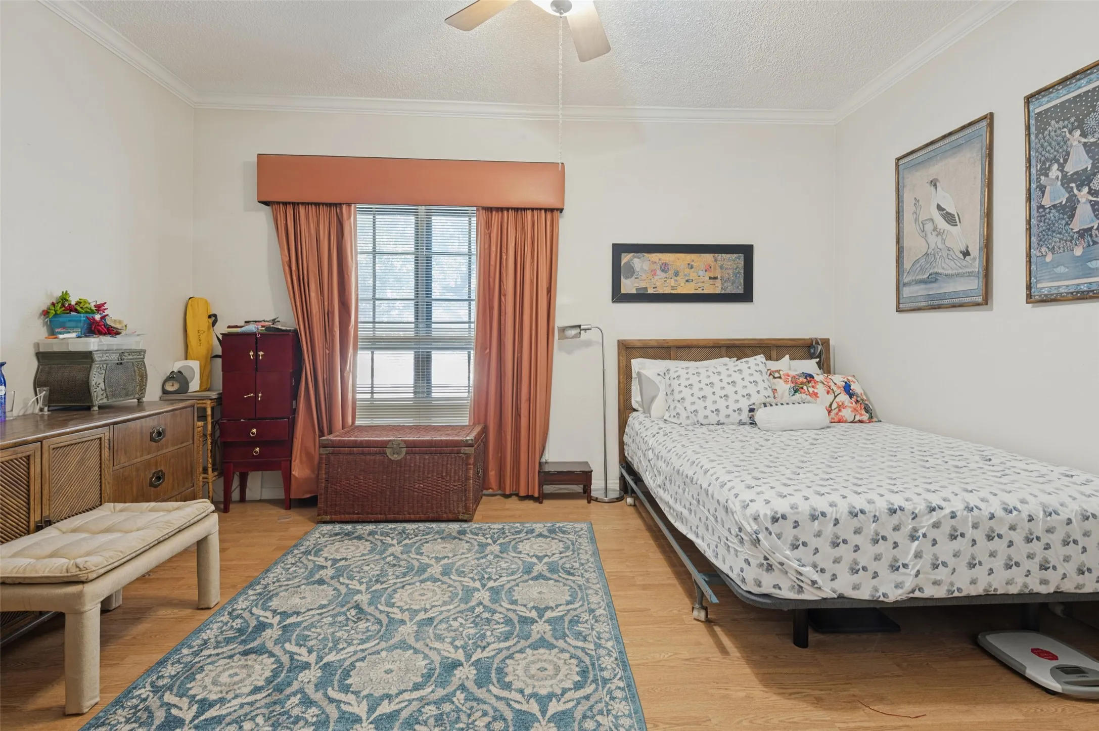 Large bedroom with ceiling fan and crown molding. And huge walk in closet.