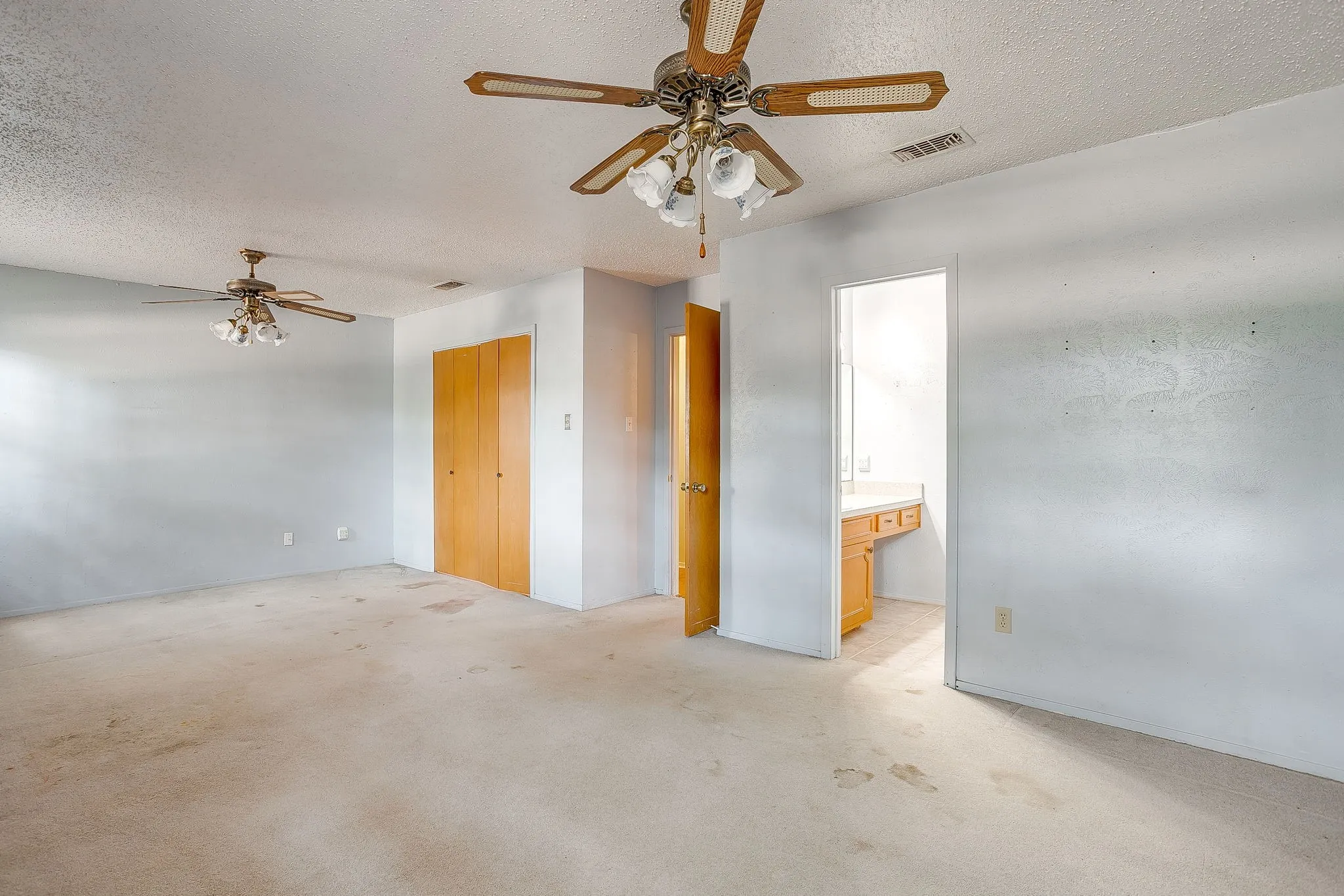 Two ceiling fans with integrated lighting