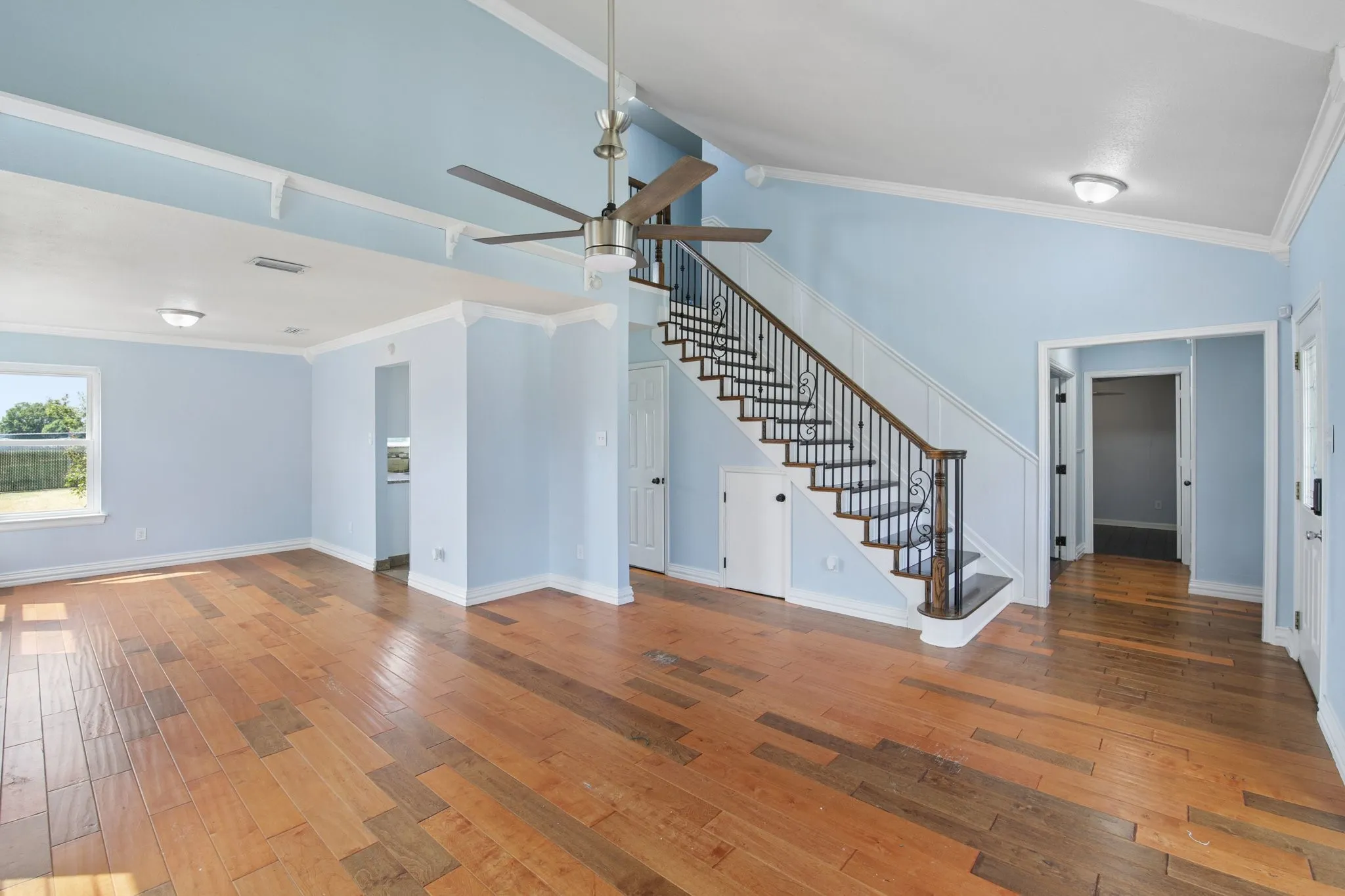 Storage abounds, including closet space under the stairs, conveniently located shelves, and built-in cabinets.