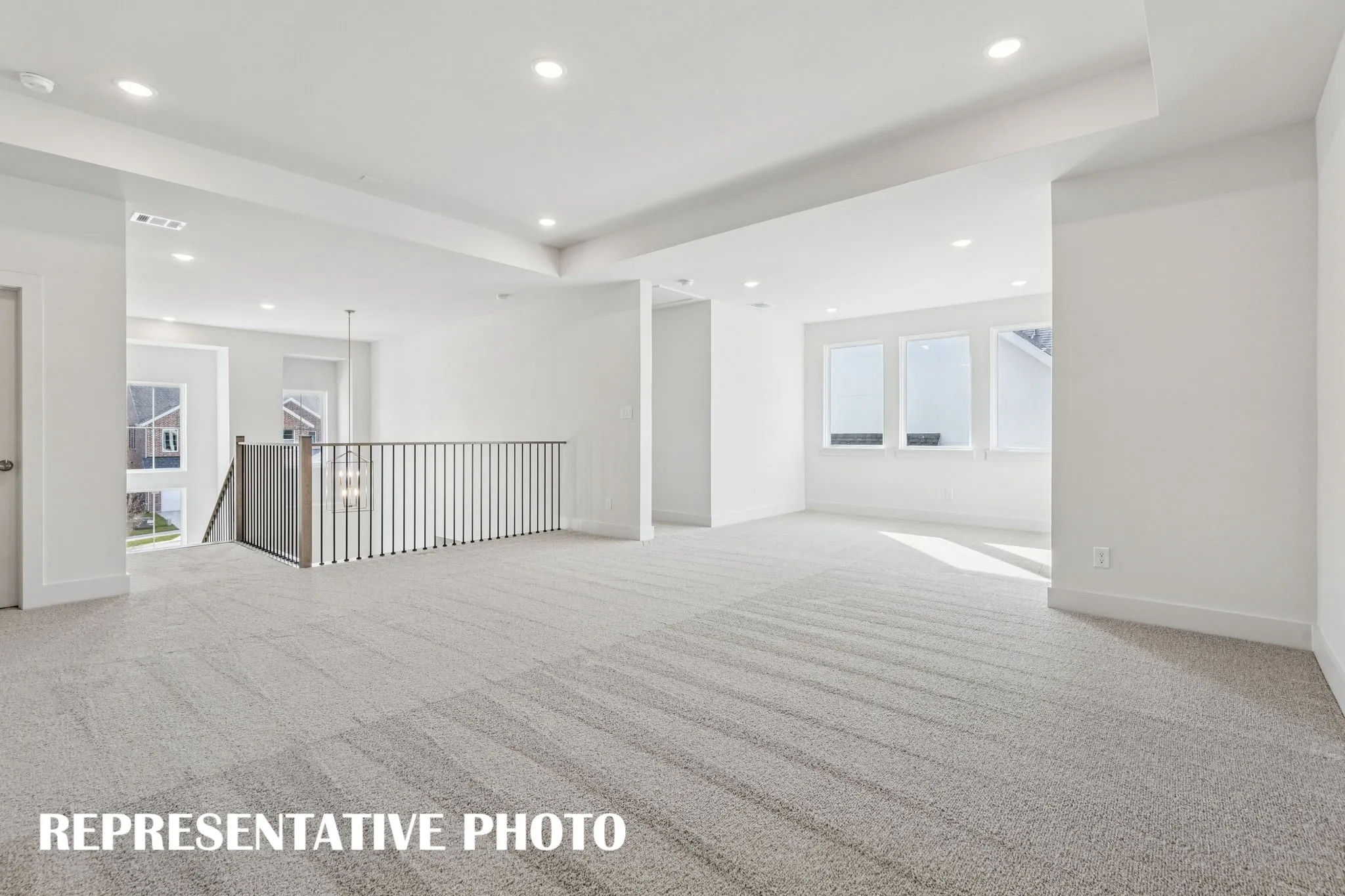 This spacious game room offers plenty of space to host those big game day parties!  REPRESENTATIVE PHOTO