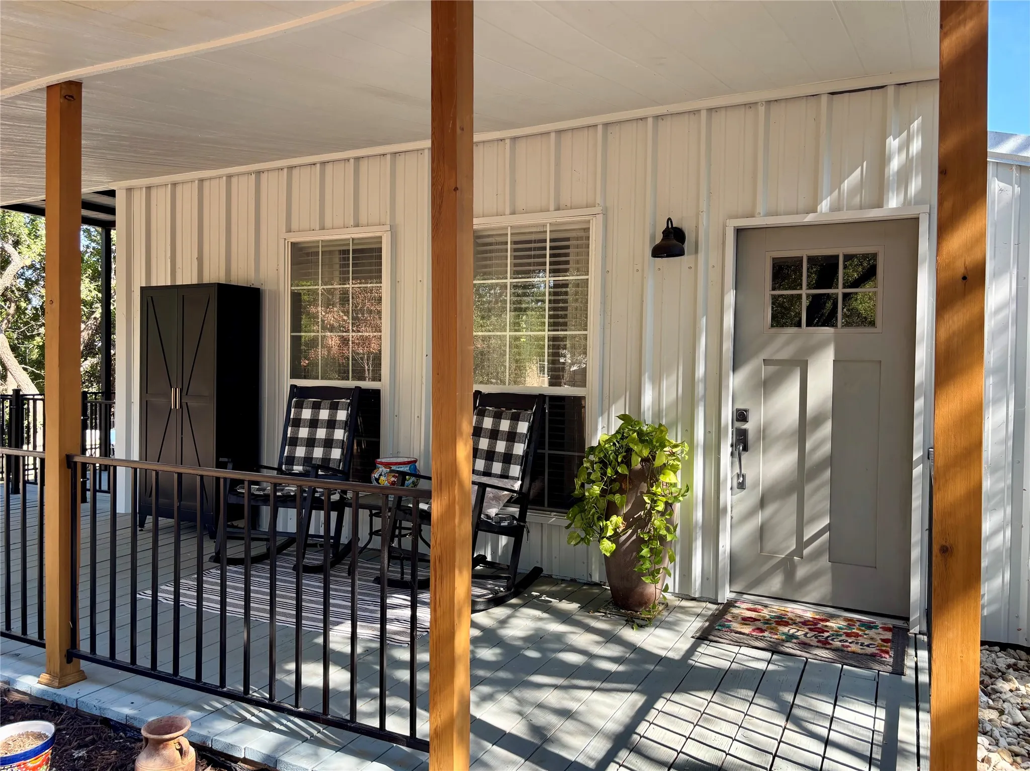 Welcome Home!! Wonderful covered porch large enough to relax or enjoy with friends and family.