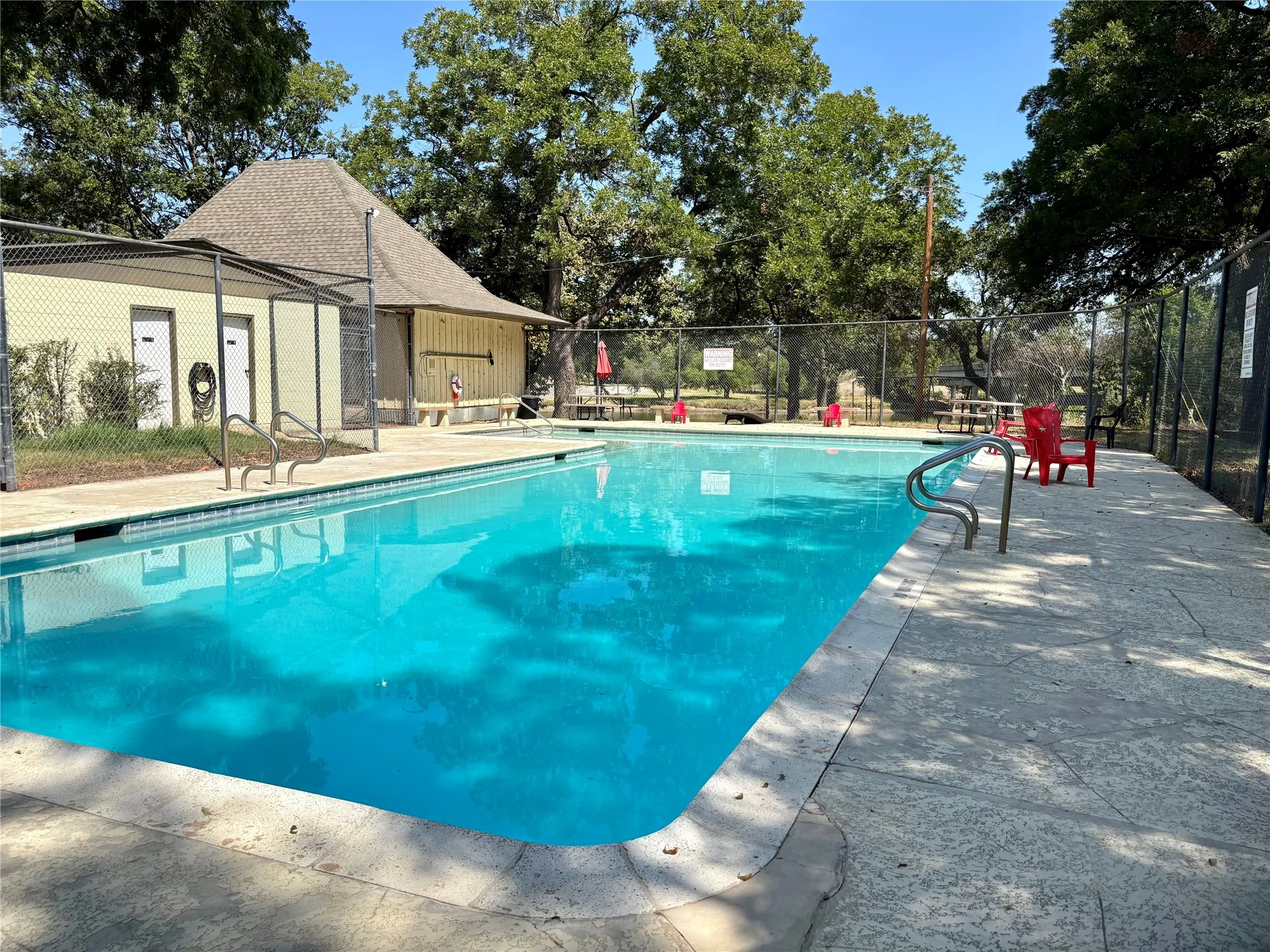 Rio Brazos POA includes private swimming pool with surrounding perimeter fencing, pool house,  playground and access to the Brazos River