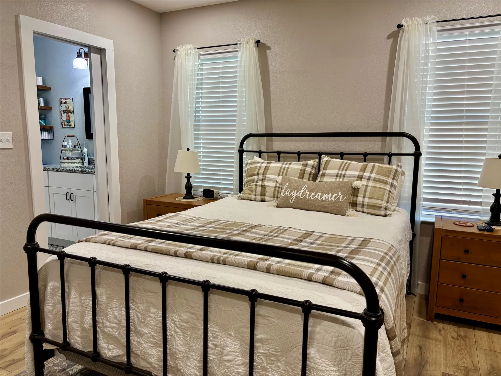 Downstairs bedroom with private bathroom, walk-in closet and wall mounted TV