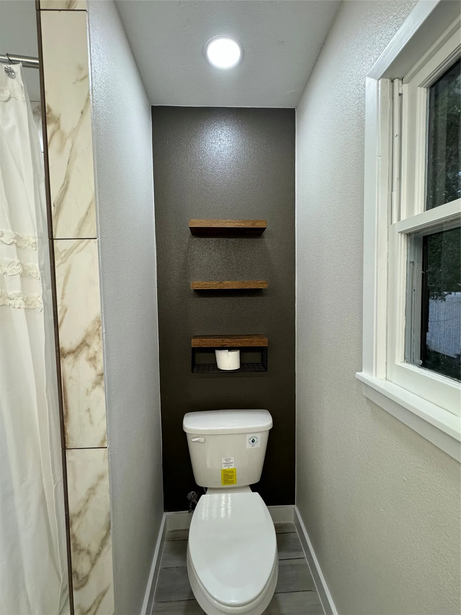 Bathroom with toilet and walk in shower