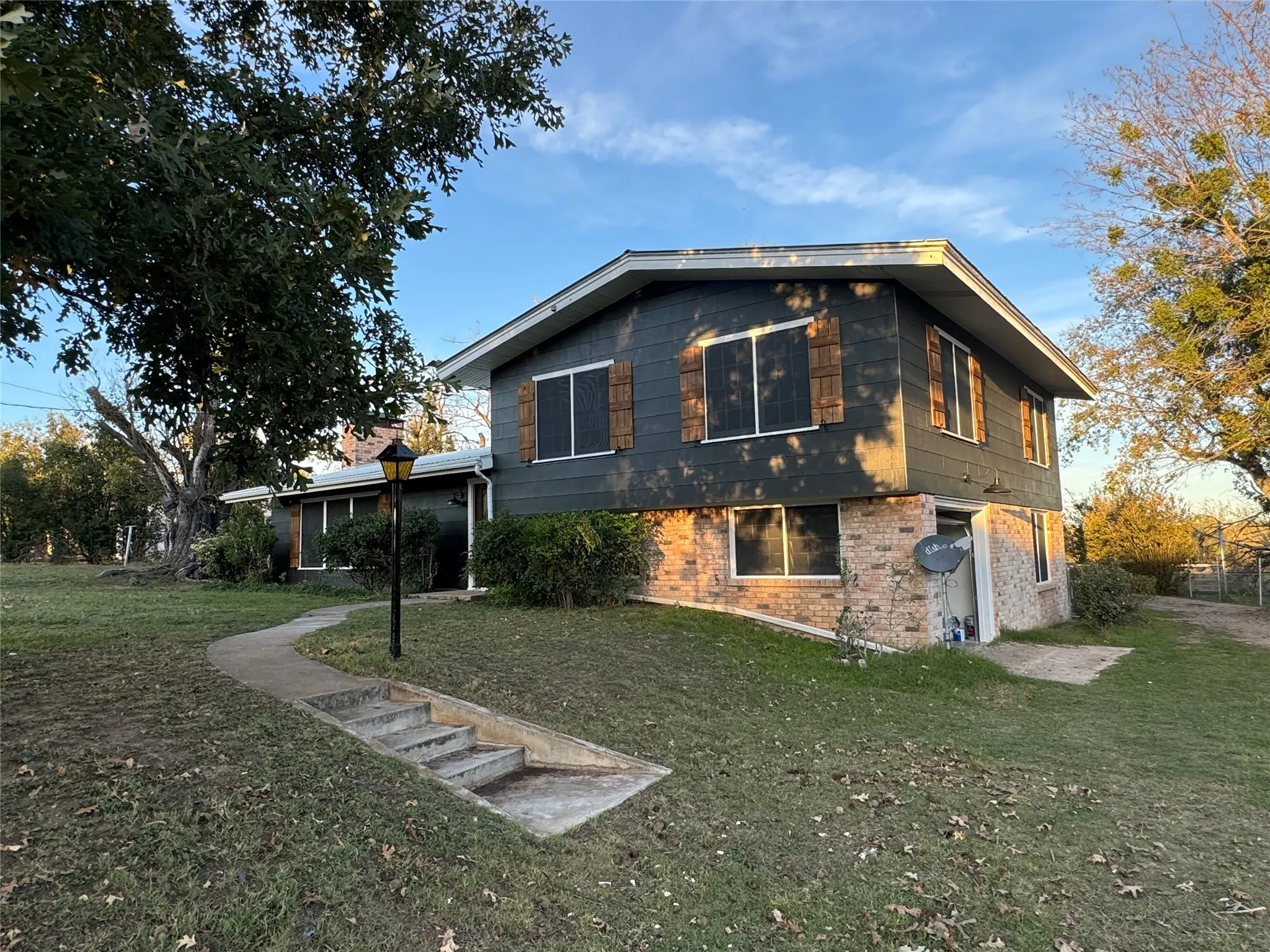 View of home's exterior featuring a lawn