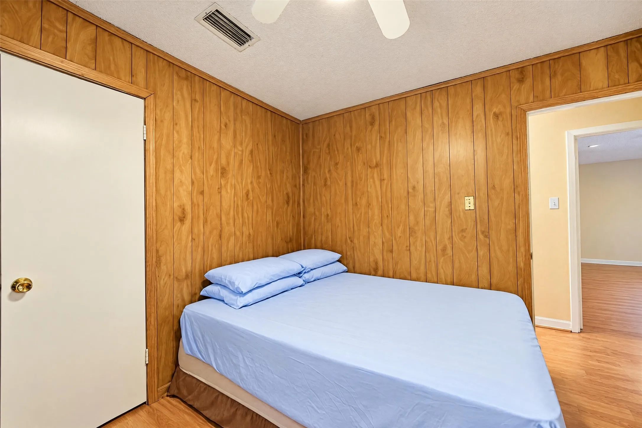 Wood-panel accent wall and wood-finish flooring