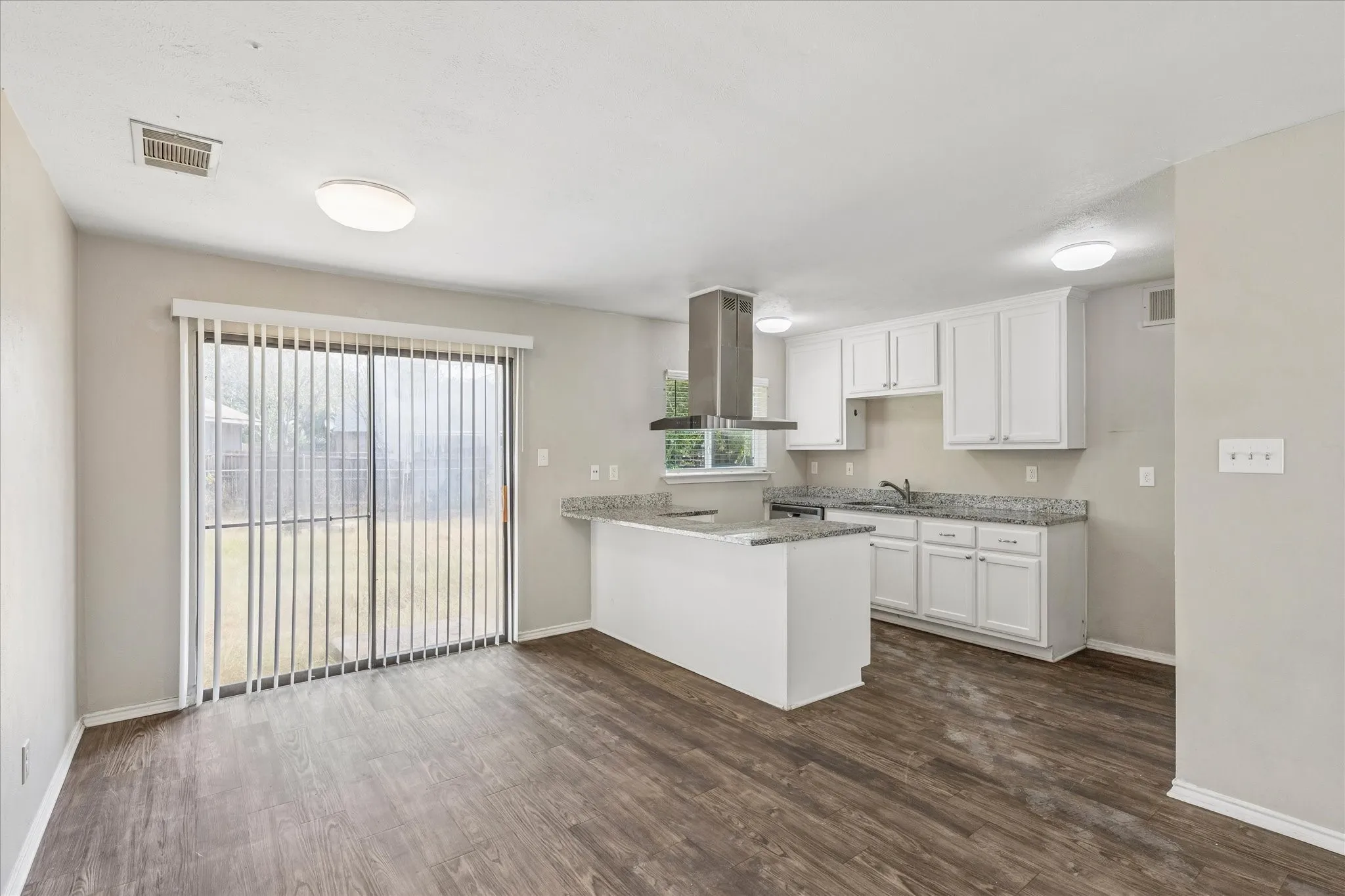 Good-sized dining room with easy access to the backyard and kitchen