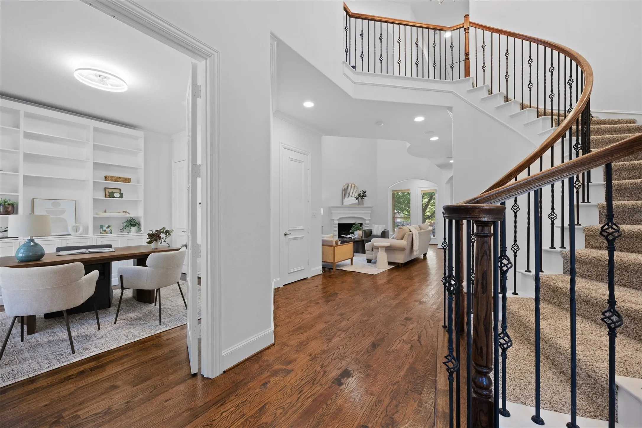 The grand stairwell and nailed down hardwood floors greets you as you come in the front door.