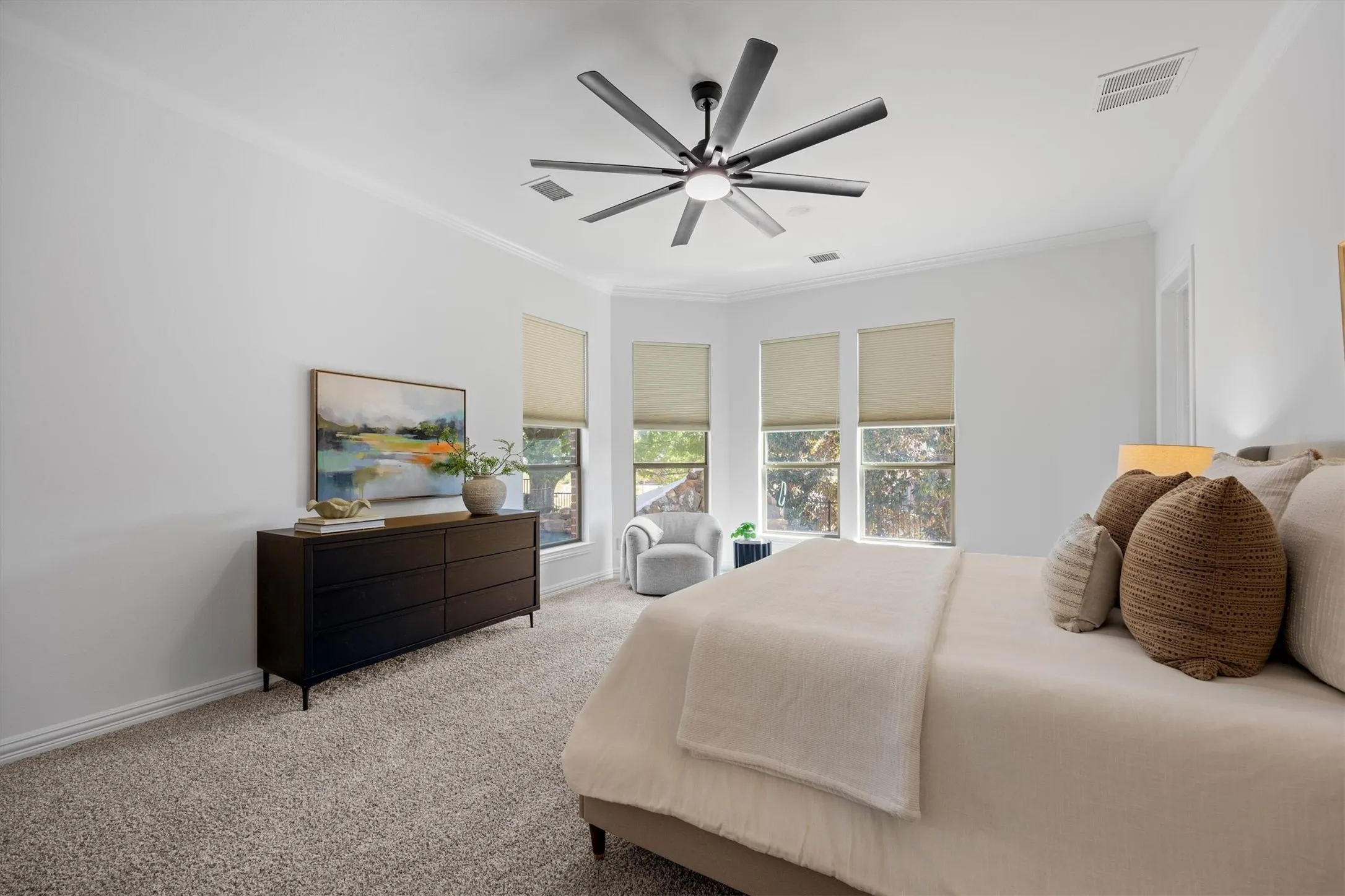 This spacious primary offers room for a good amount of furniture including a sitting area!