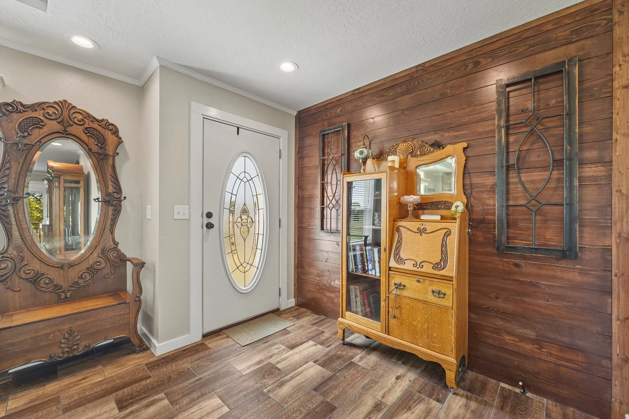Entry with stained accent wall and coat closet