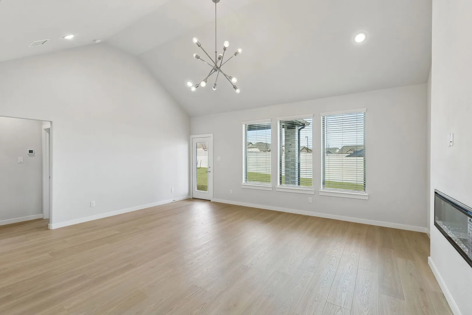 Dining and Living Room in the Stanley II home plan – REPRESENTATIVE PHO