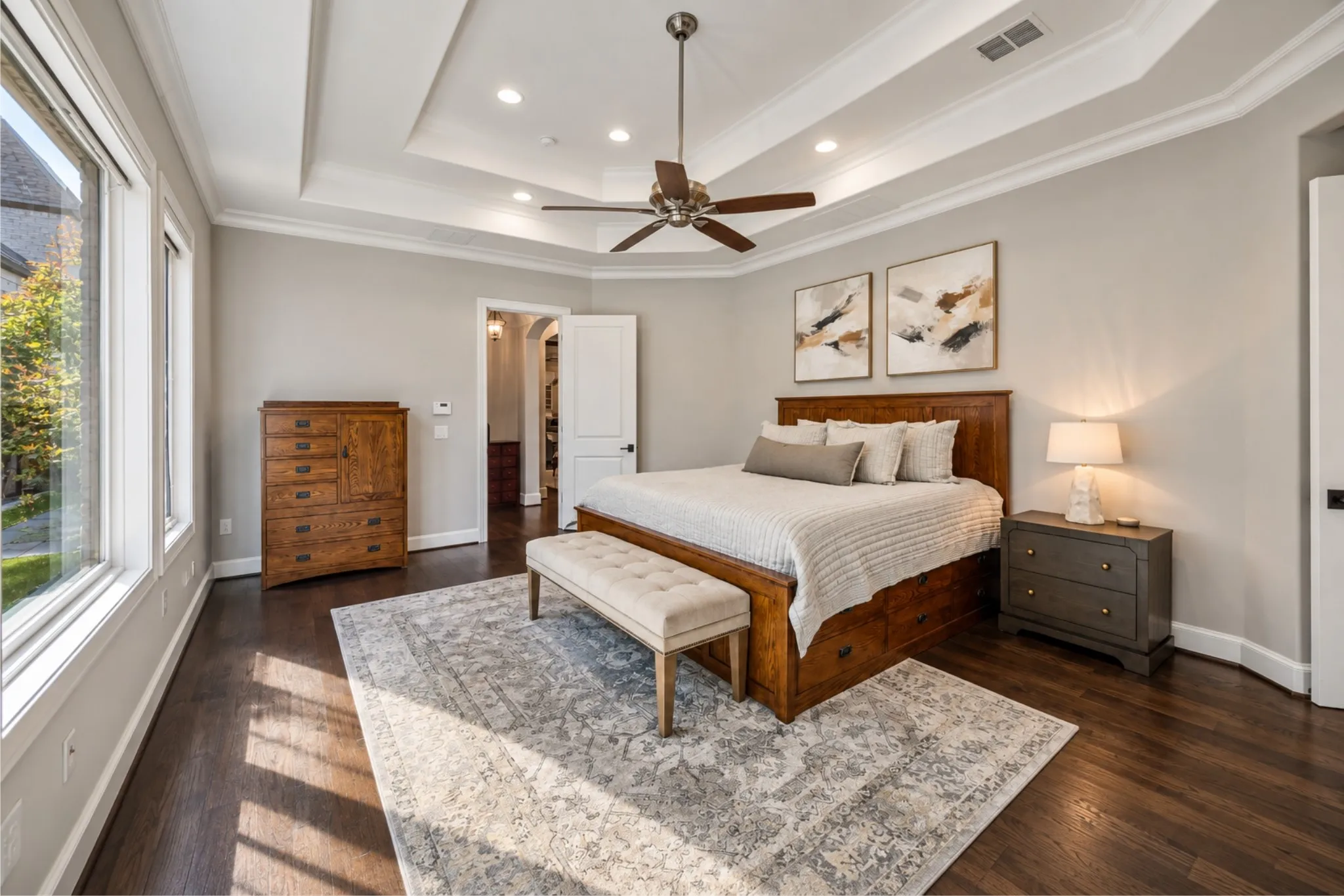 Tray ceiling with recessed lighting and crown molding