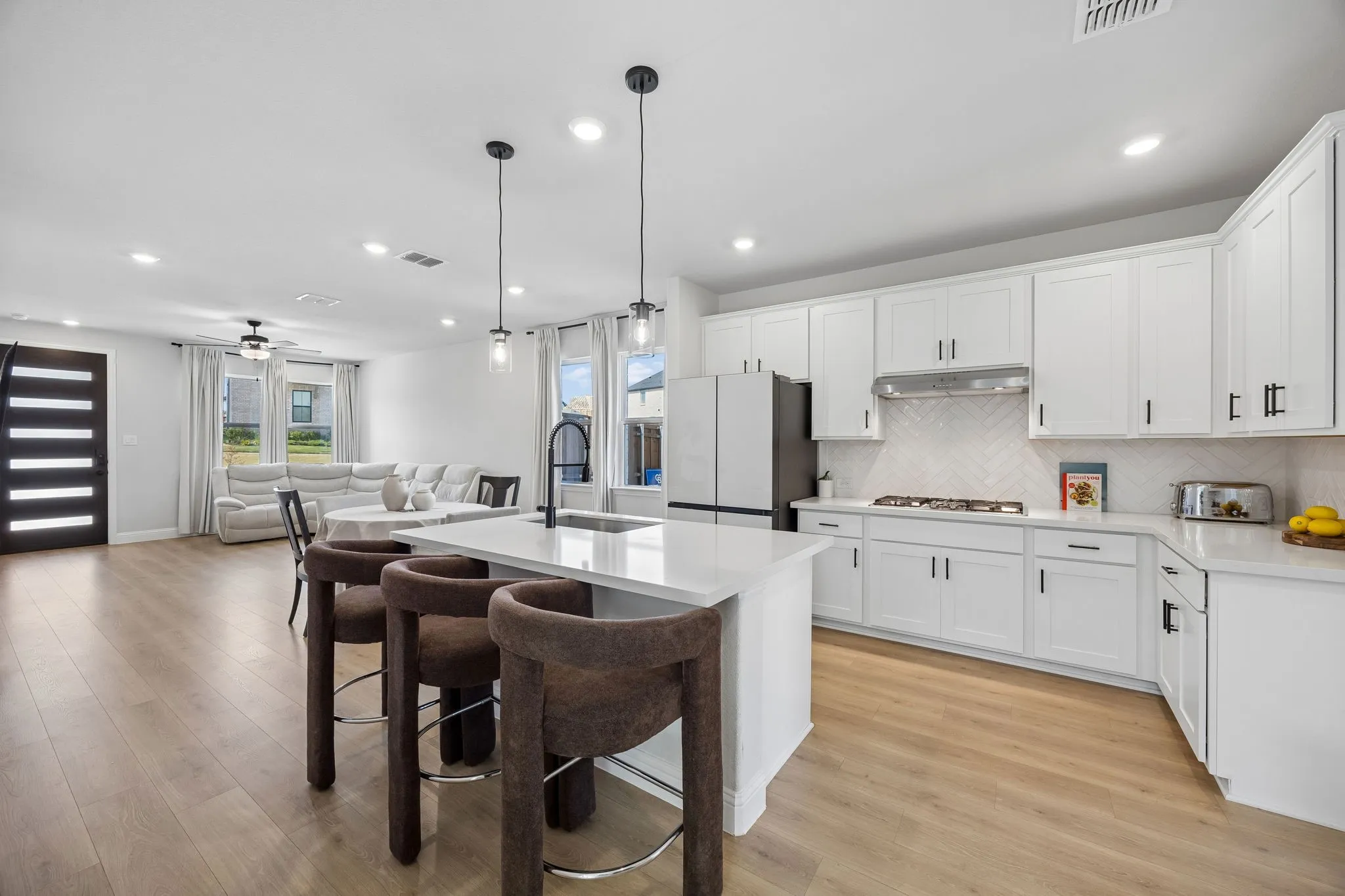 Spacious open-concept layout with wood-finish flooring