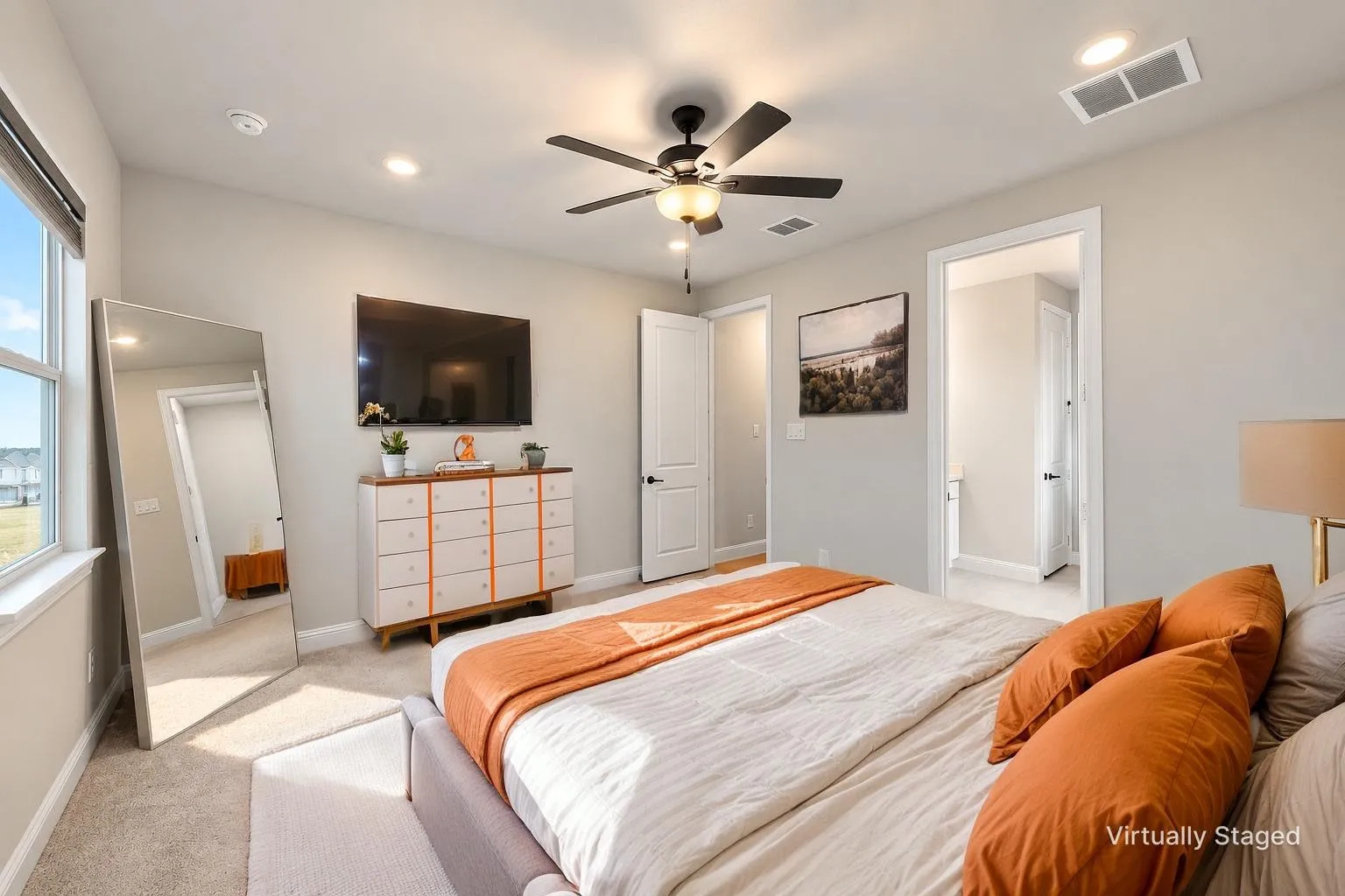 Recessed lighting, ceiling fan, carpet flooring, and a large window