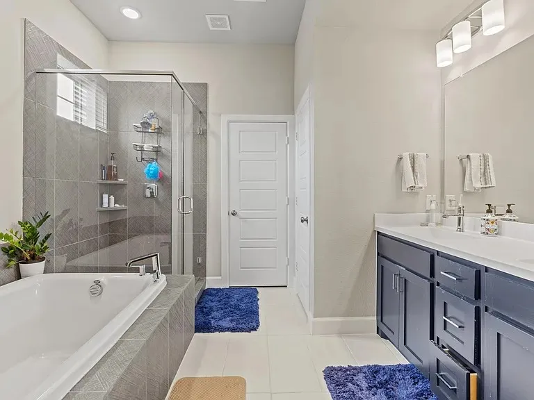 Double vanity with undermount sinks and dark cabinetry