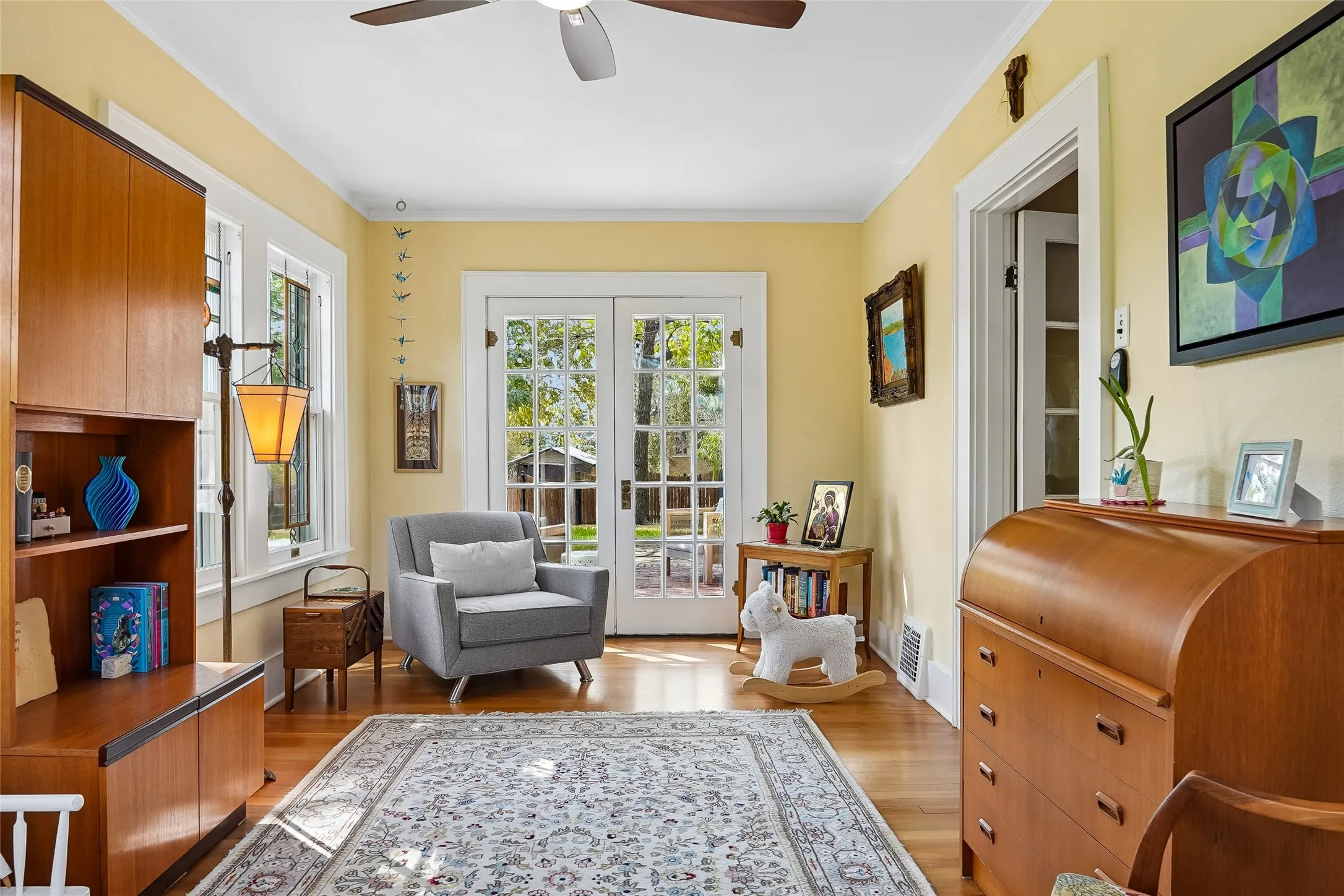 Hardwood flooring, ceiling fan, French doors