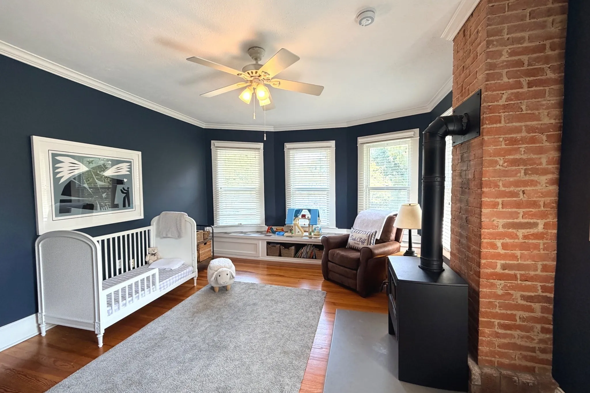 Southeast corner bedroom with bay window overlooking the streetscape below.