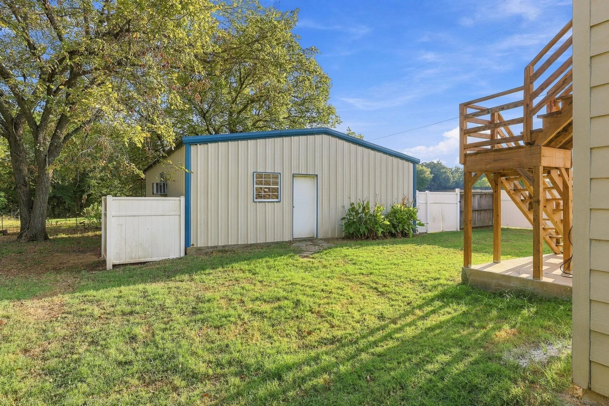 Detached metal 30x40 building with Doublewide garage door.