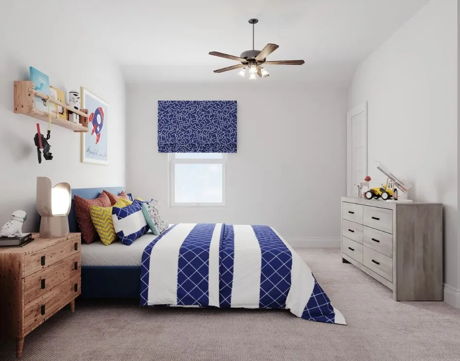 Neutral wall paint with a ceiling fan, window with a patterned Roman shade, and soft carpet flooring