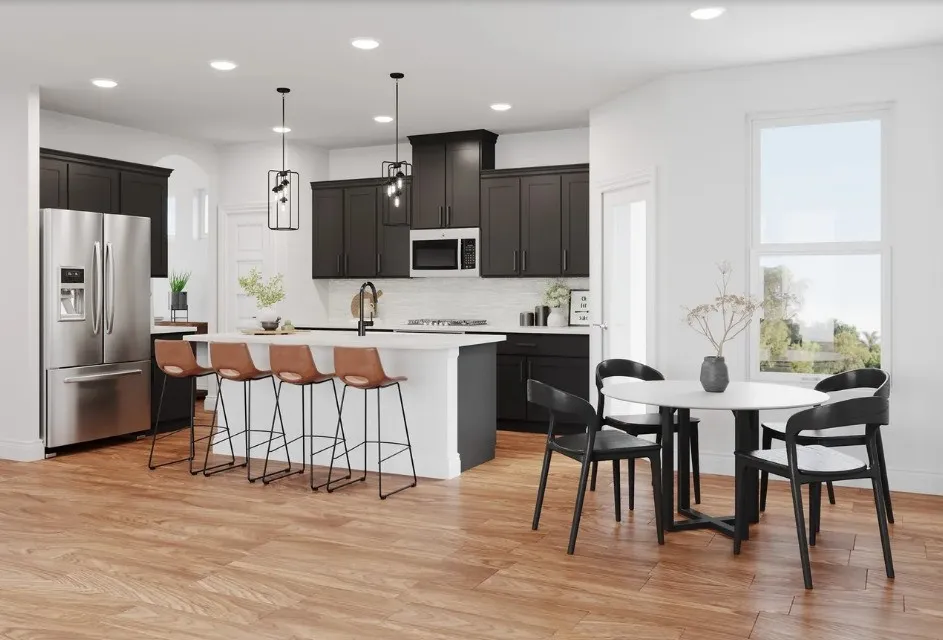 Open-concept kitchen with wood-finish flooring, dark cabinetry, and a large center island
