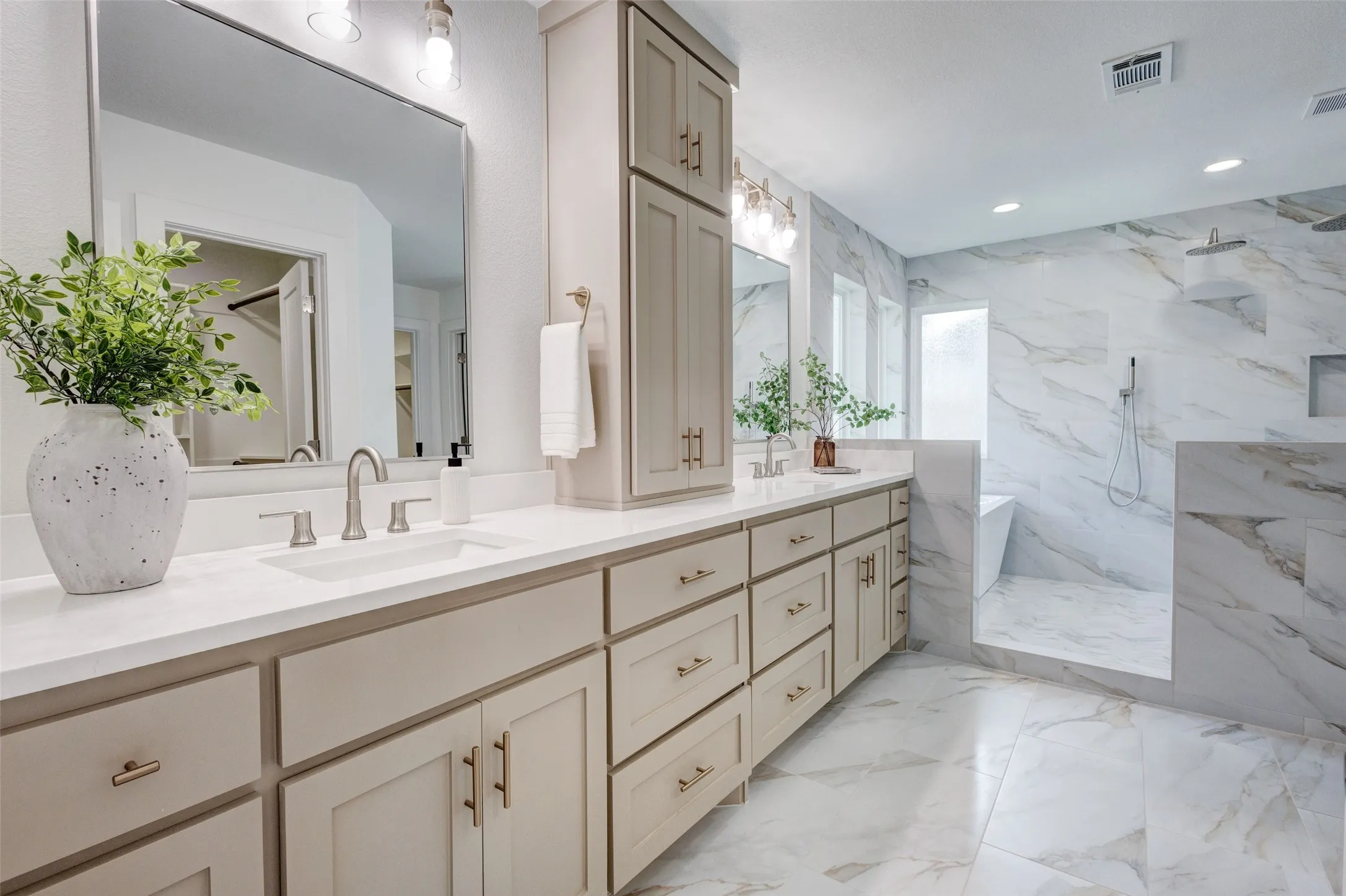 Dual vanity with undermount sinks and light-toned cabinetry