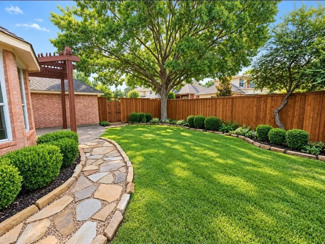 Expansive backyard featuring a natural stone pathway, wood pergola, mature trees, and a wooden privacy fence