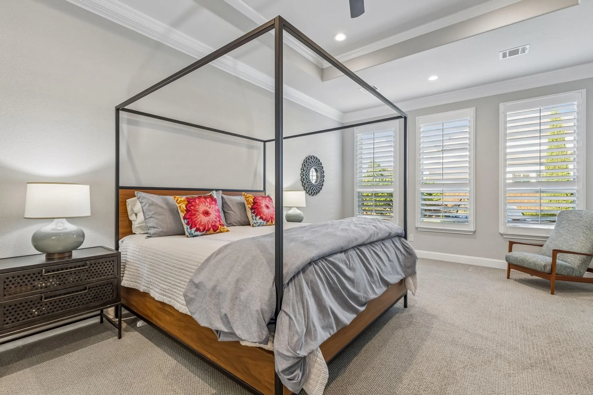 Spacious primary bedroom featuring a private sitting area, creating the perfect retreat to relax and unwind.
