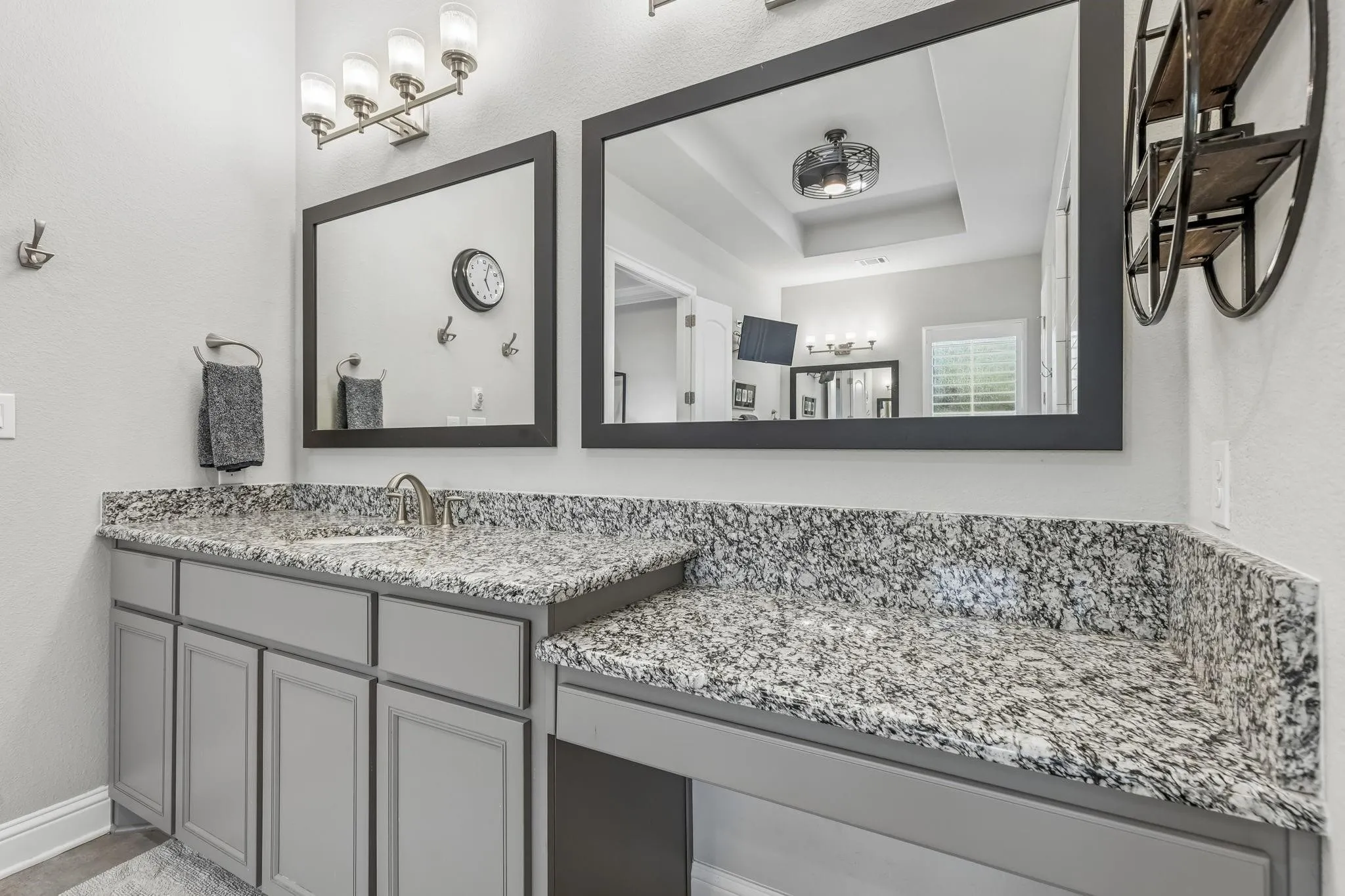 Built-in vanity with ample countertop space creates the perfect spot to get ready each day.
