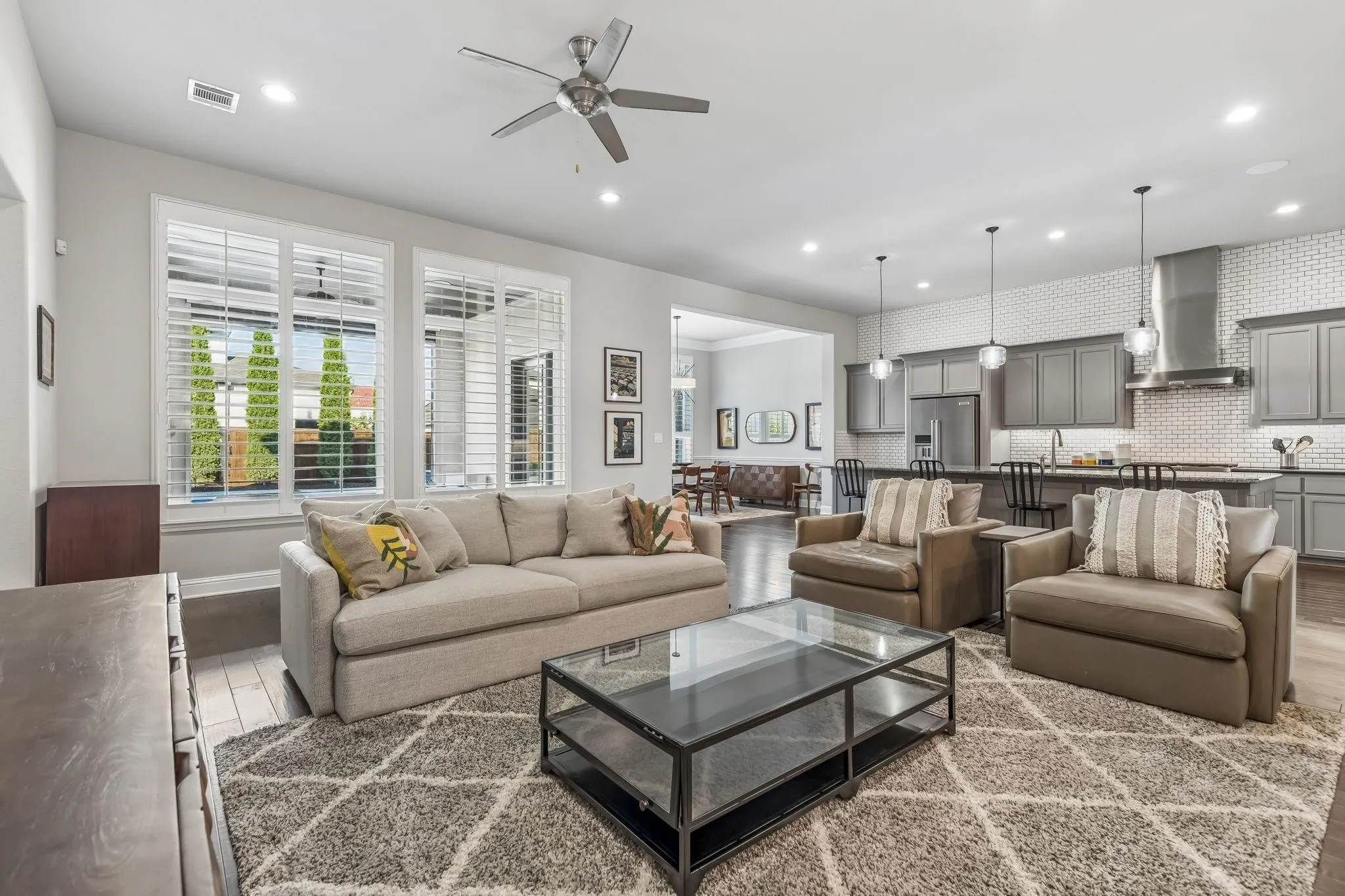 Inviting living area featuring beautiful plantation shutters that add timeless elegance and natural light control.