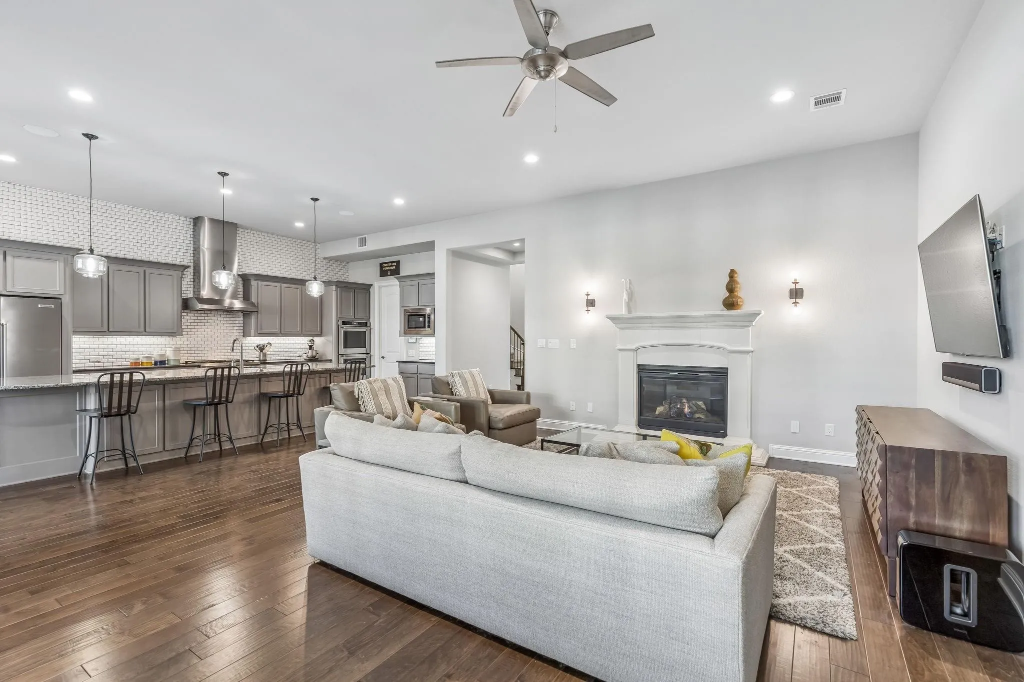 The open-concept design creates a seamless flow between the kitchen, dining, and living areas perfect for everyday living and entertaining.